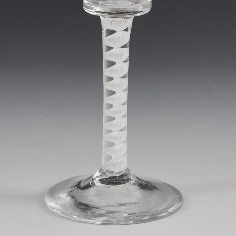Heading : Single series opaque twist wine glass
Period : George II / George III - c1760
Origin : England
Colour : Clear
Bowl : Waisted bucket
Stem : Multi-ply corkscrew
Foot : Conical
Pontil : Snapped
Glass Type : Lead
Size :  15.3cm height, 6cm