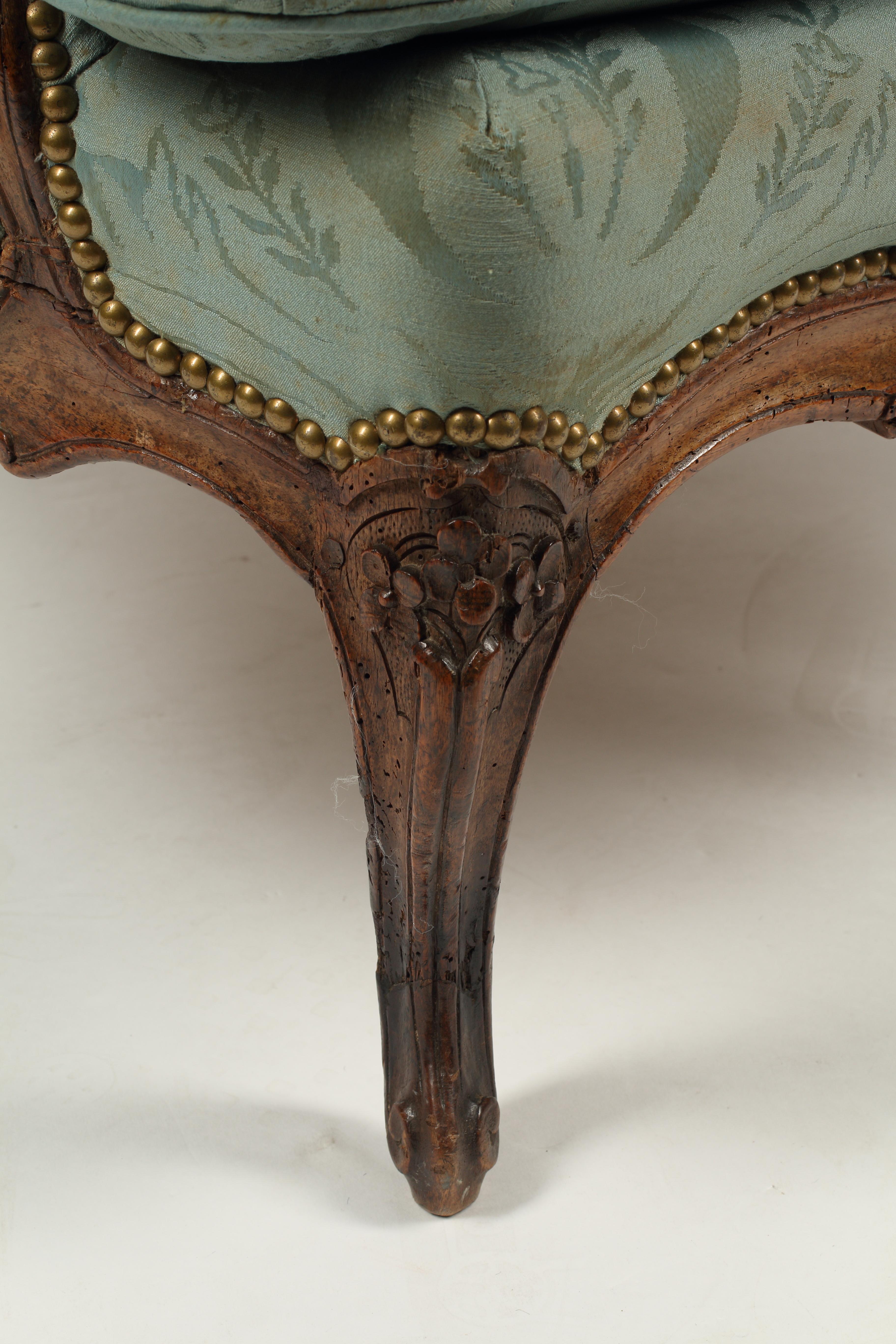 French Provincial 18th Century Walnut Bregere, Upholstered For Sale