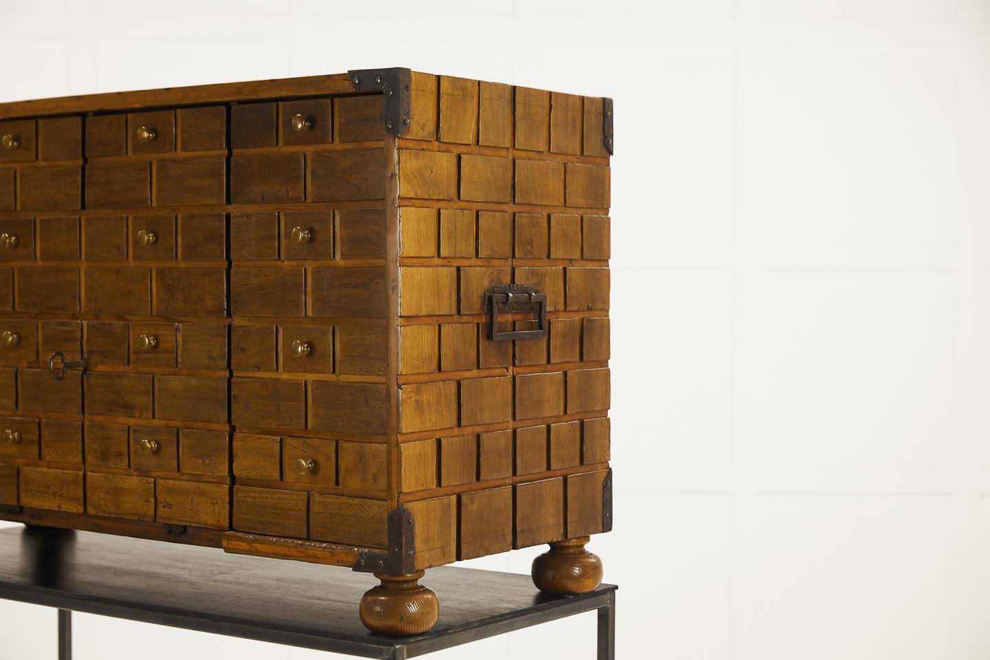 Unusual, 18th century walnut cabinet with 11 drawers on later stand. A very contemporary looking piece, possibly Spanish or Italian, circa 1780.