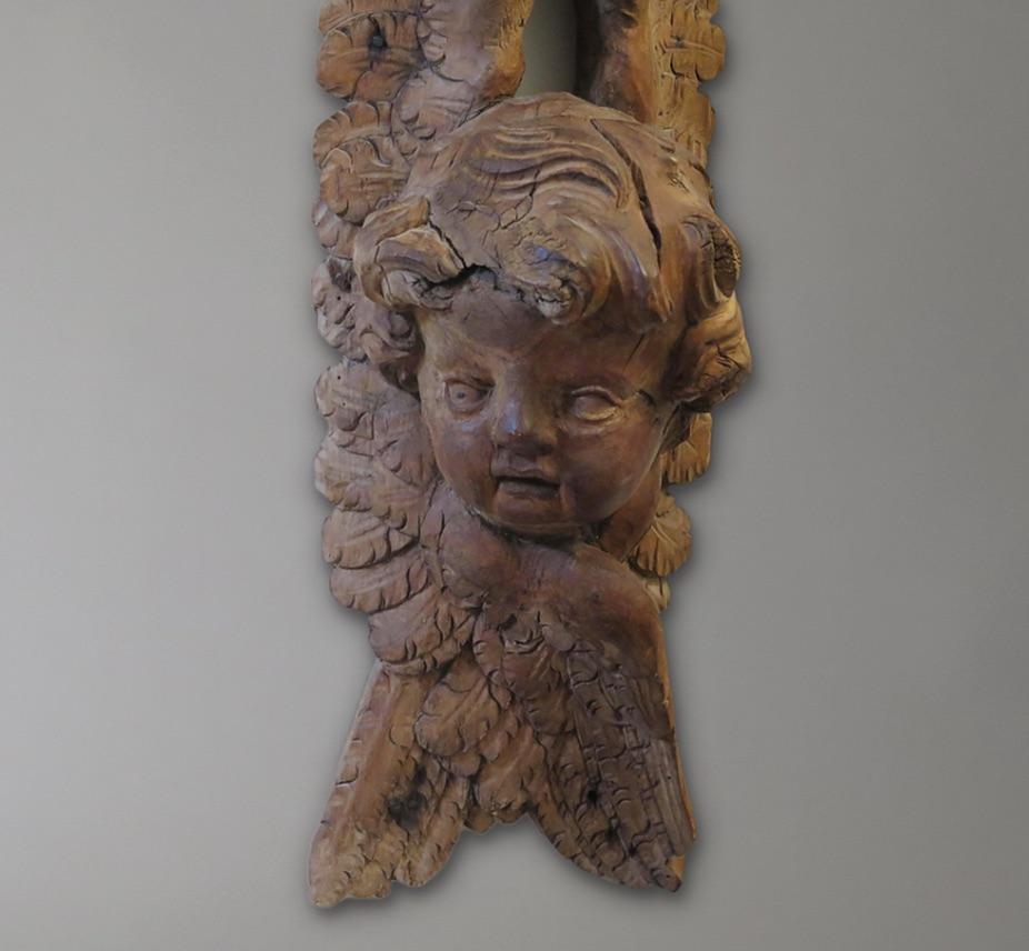 Ornately-Carved Walnut Carving of an Angel. France, circa 1700s. Possibly from a ship or country estate.
