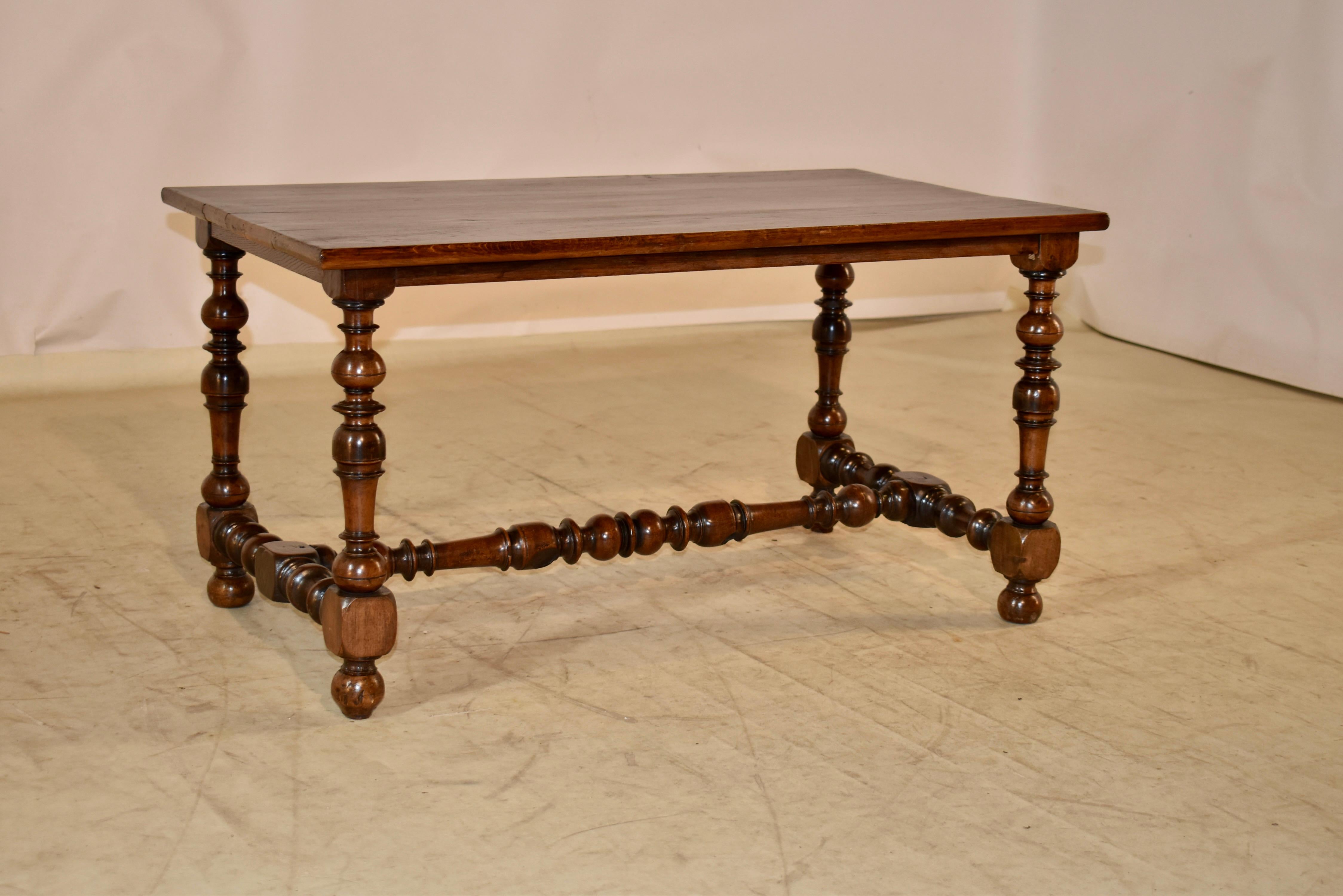 This is a lovely coffee table. The base is period Louis XV which dates from around 1750-1770, and is made from walnut. The top is a later addition, but added most likely in the 19th century, and is made from oak. The top has pretty graining tot he