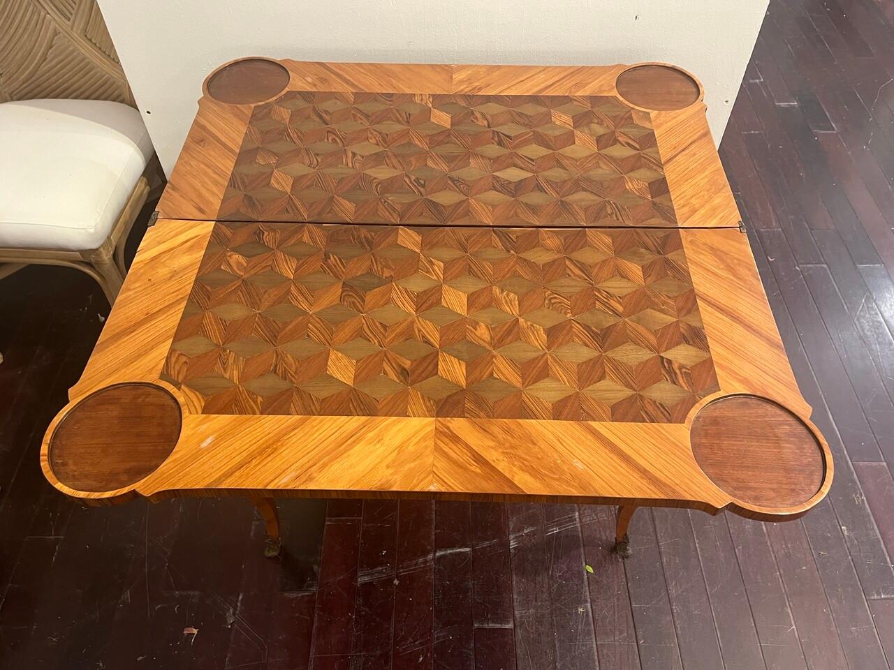 18th Century Walnut and cherry Game table with exquisite Marquetry. Has fold over top with storage. C 1760-1770 Berlin, Germany
missing one foot cap.