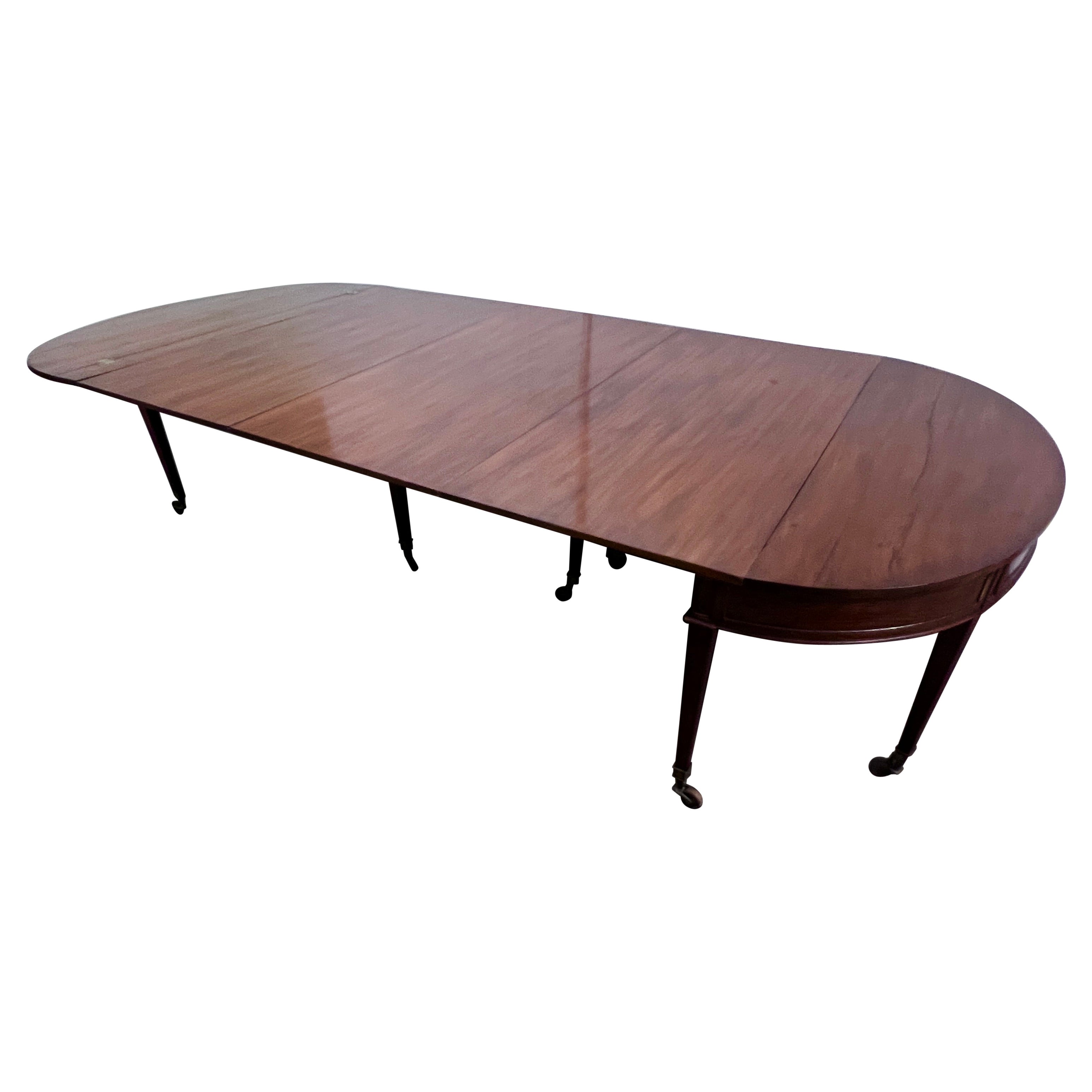 18th Century Walnut expandable Dining or Console Table.  The front is masterfully crafted and carved into panels with Brass or Bronze beading for detail.

Demi lune 25.75 x 59
Table Fold-over opened 47.5x59
One leaf 74.75x 59
Two leaves 102 x