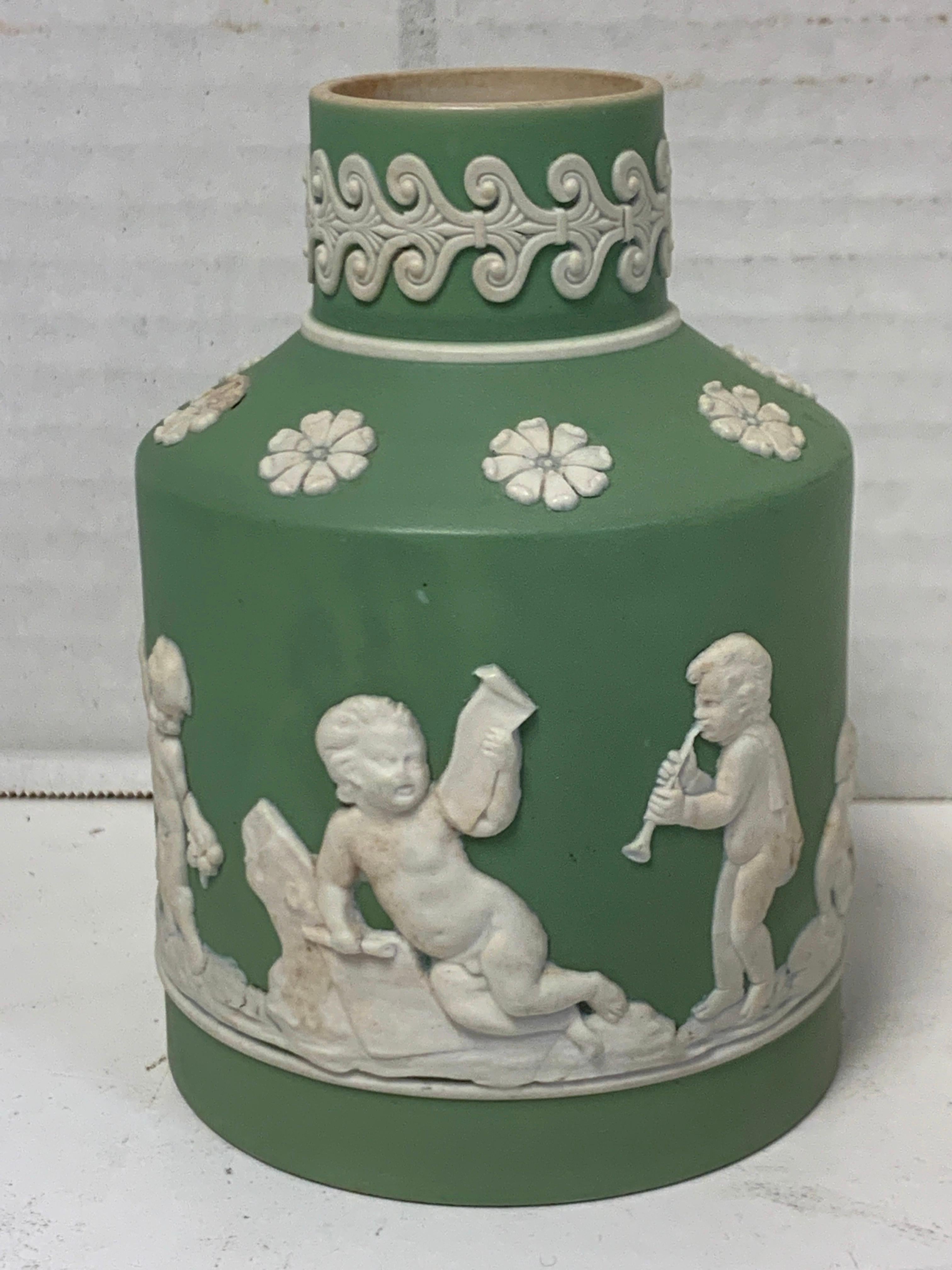 18th century Wedgwood olive jasperware tea caddy, lacking cover, an exceptional example with continuous putti decoration made between 1759-1769.