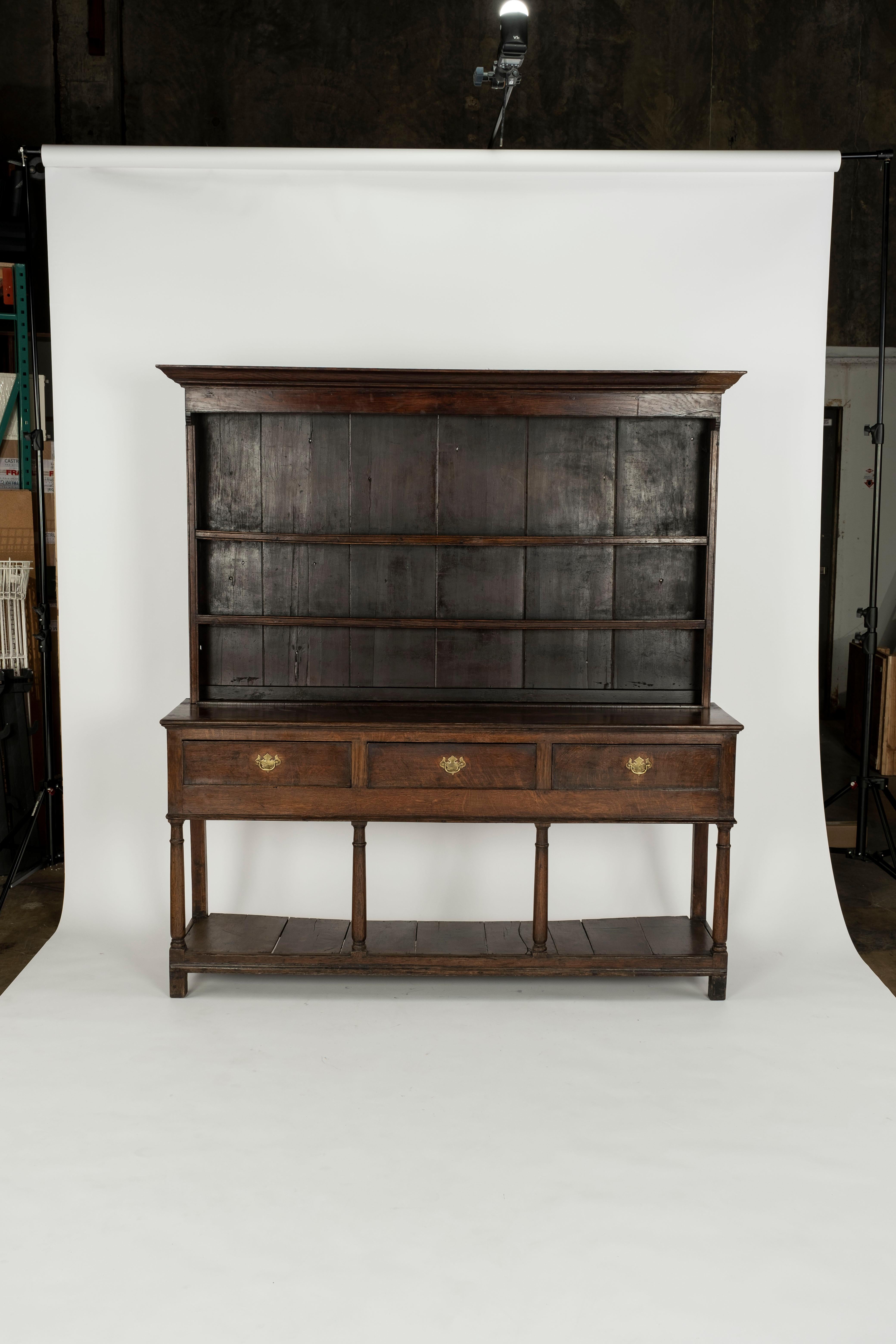 Beautiful and authentic 18th Century Welsh Dresser Base with 3 drawers and double shelf plate rack.