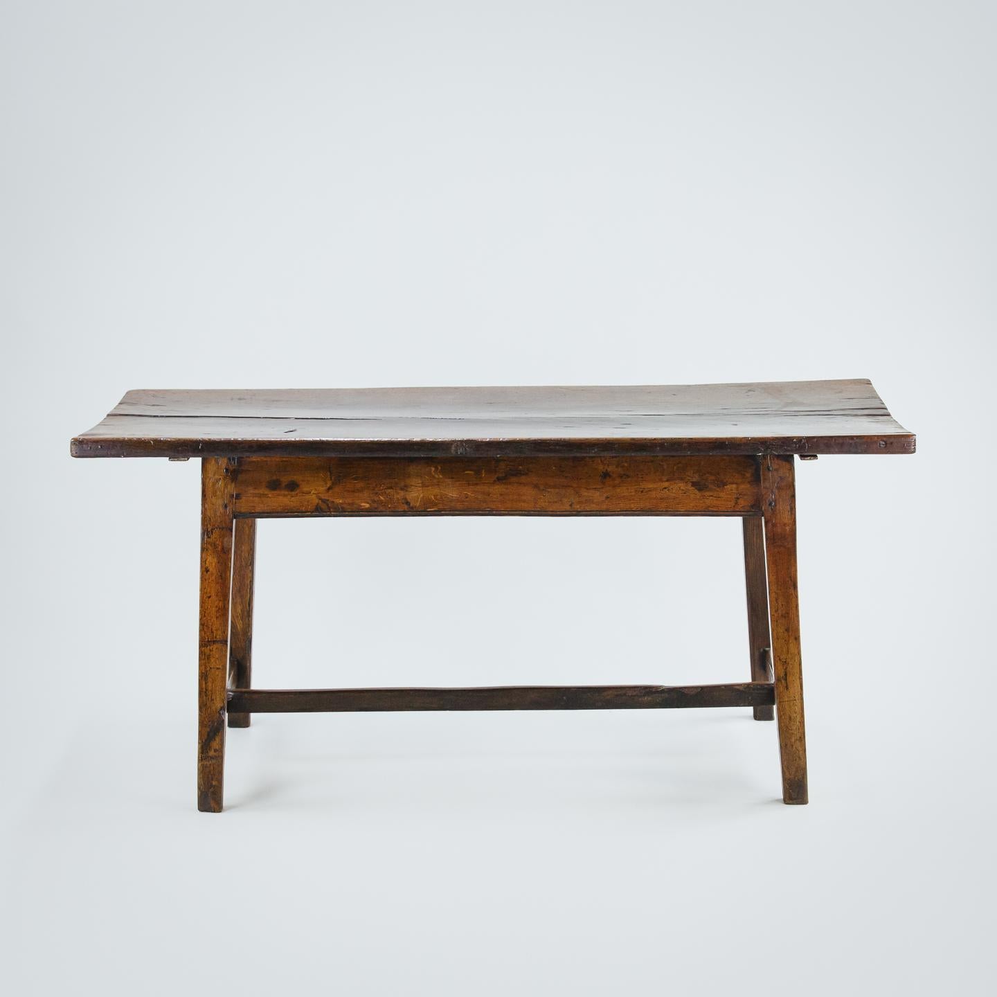 Extraordinary Georgian welsh single plank oak farmhouse table, good colour, patination and wear to stretchers and top. Unusual decorative lozenge inlay most likely in holly on the apron or skirt. 

Some minor bowing of the top some drying splits