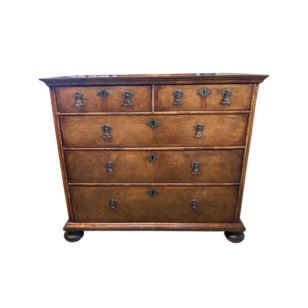 William and Mary chest of drawers hand-made in England in the early 1700s using oak. This is a gorgeous piece with a very long history. When we first saw it we knew we wanted it, and to be honest, were we still living in the US we would have taken