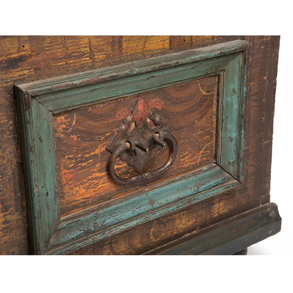 This wooden chest with hand-forged iron fittings has a beautiful age patina, which is exactly what makes this object so charming, because that's exactly what the aged wood has to look like. The painting is captivating because of the finely executed
