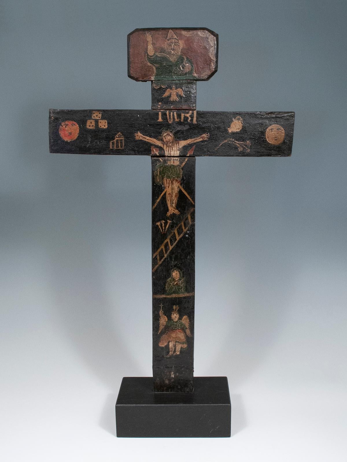 Wooden cross
Guanajuato, Mexico
Wood, paint
22 x 13 inches, (56 cm x 33 cm)
18th century

A wonderful old wooden cross with a painted crucified Christ figure, an angel, possibly Mary Magdelene, God and the Holy Spirit, and various items