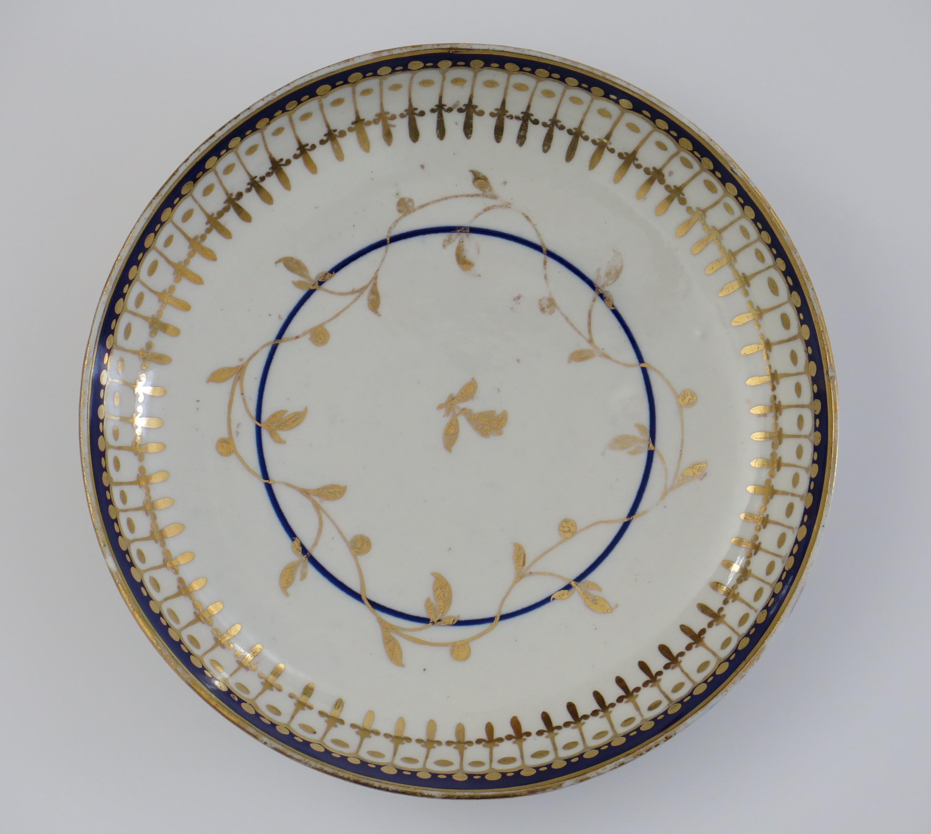This is a good late 18th century Worcester porcelain Slop bowl or Saucer Dish with a combined blue and gold pattern, fully marked and dating to circa 1780.

The bowl is decorated in a classical pattern of underglaze blue with hand gilded overglaze
