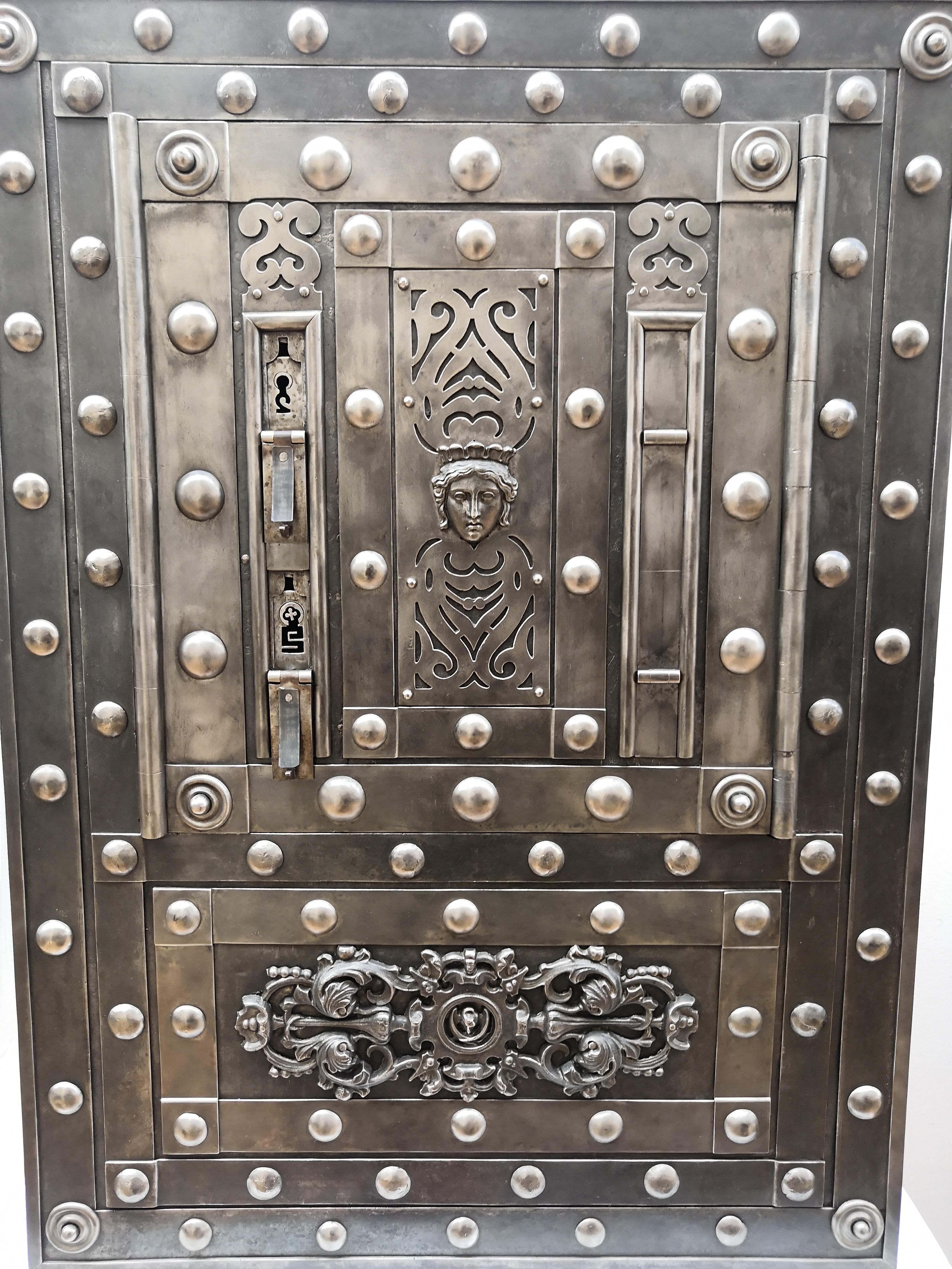 Northern Italian antique safe with typical all-around hobnails, dated circa 1790-1820, probably used inside a small feud fiefdom or fortified town castle of the Piedmont region, Italy's second-largest region where great landscapes are purveyors of