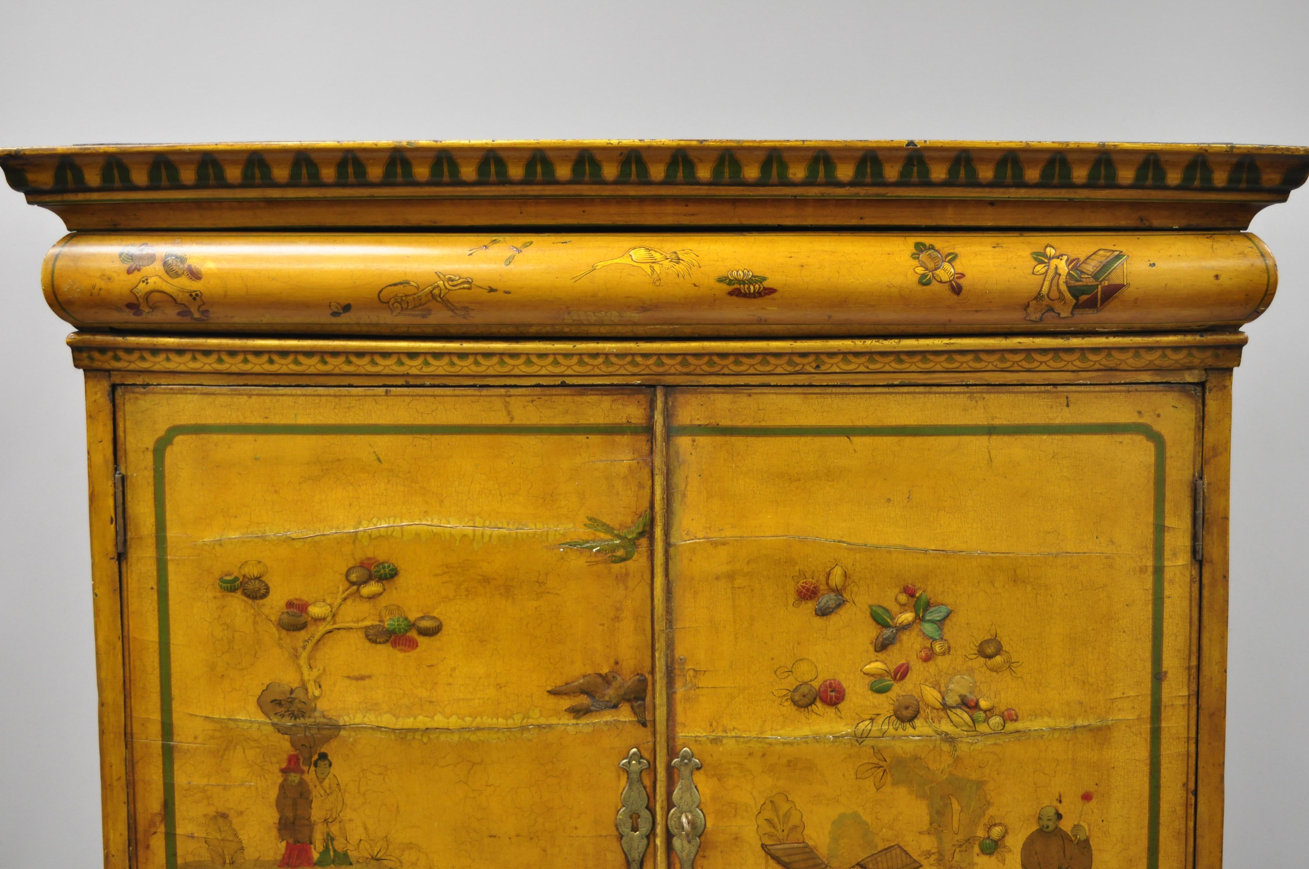 Antique 18th century William and Mary yellow lacquer polychrome Japanned parcel gilt cabinet. Item features hidden upper drawer, original yellow lacquer finish, bun feet, hand painted chinoiserie decoration, 2 part construction, working lock and key