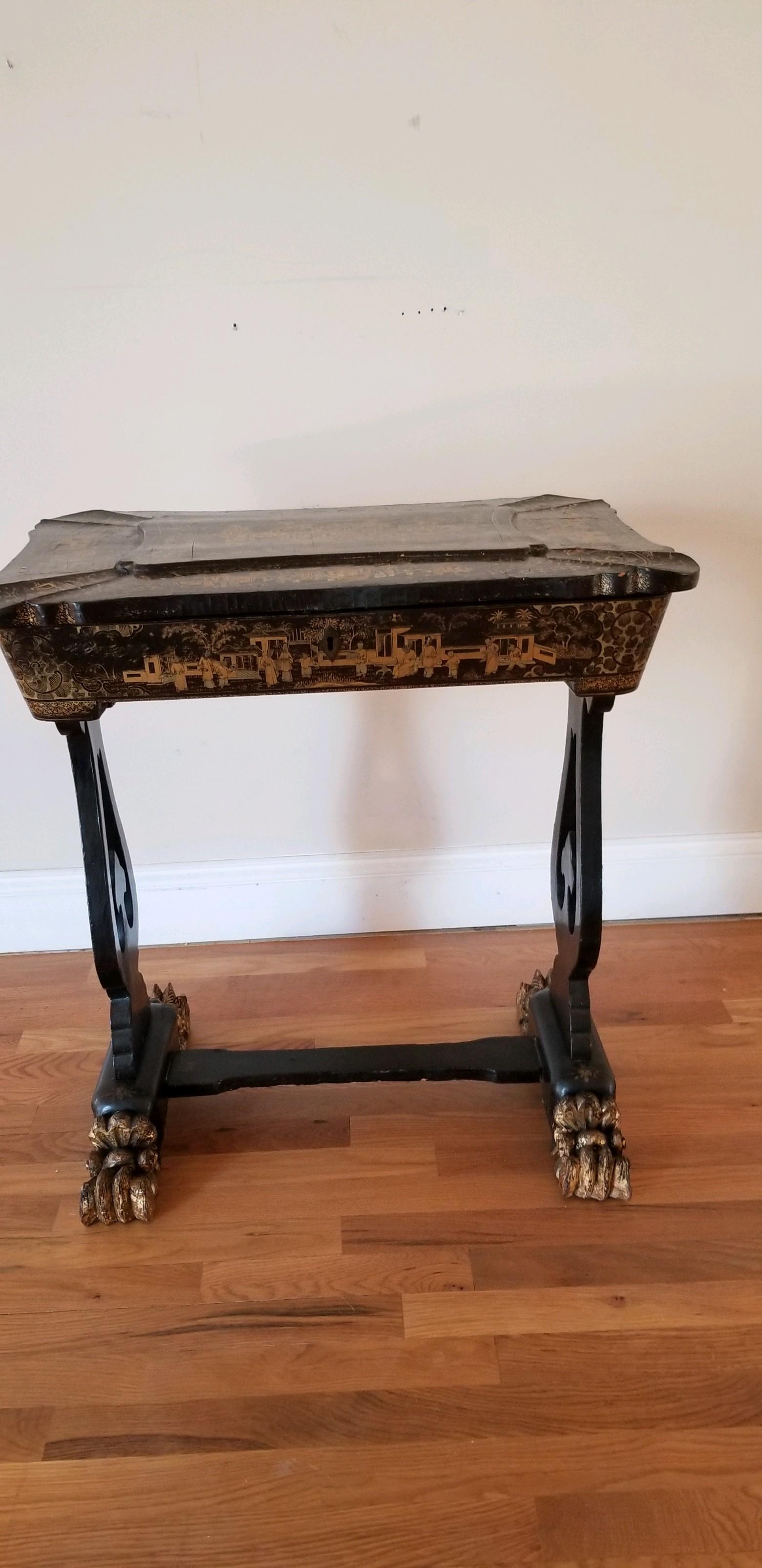 This is a rarity. An 18th early-19th century chinoiserie sewing table of exquisite form. It is the quintessential refinement for the lady's parlor of the period. Chinoiserie was all the rage as the markets were opened up for tea trading then