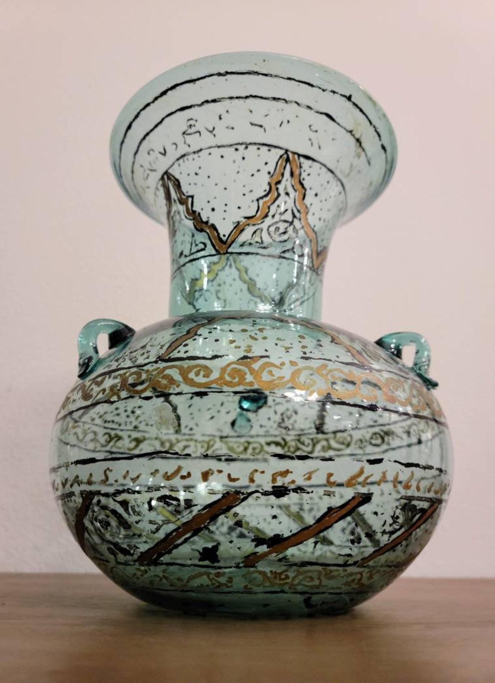 A scarce antique, circa 1785, Middle Eastern hand painted and blown glass Mosque lamp, 18th / early 19th century, the stunning blue glass mosque oil lamp having a large flared rim, over bulbous body, with three glass handles to the body used for