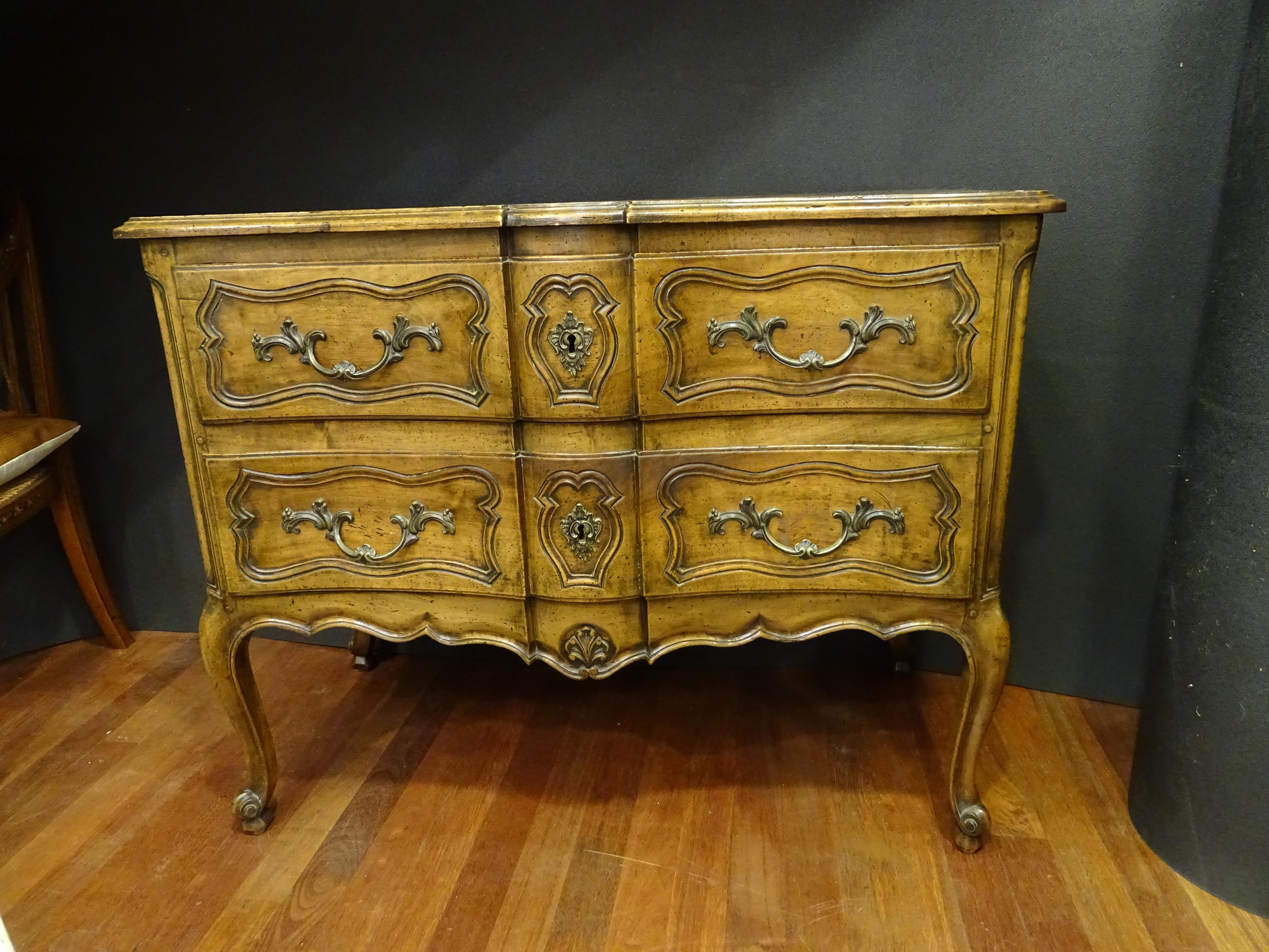 Gorgeous Lyonnaise commode or chest of drawers, 18th century , made of an extraordinary solid walnut wood with gilded bronze trim. Acquired in a private French collection.
It's called 