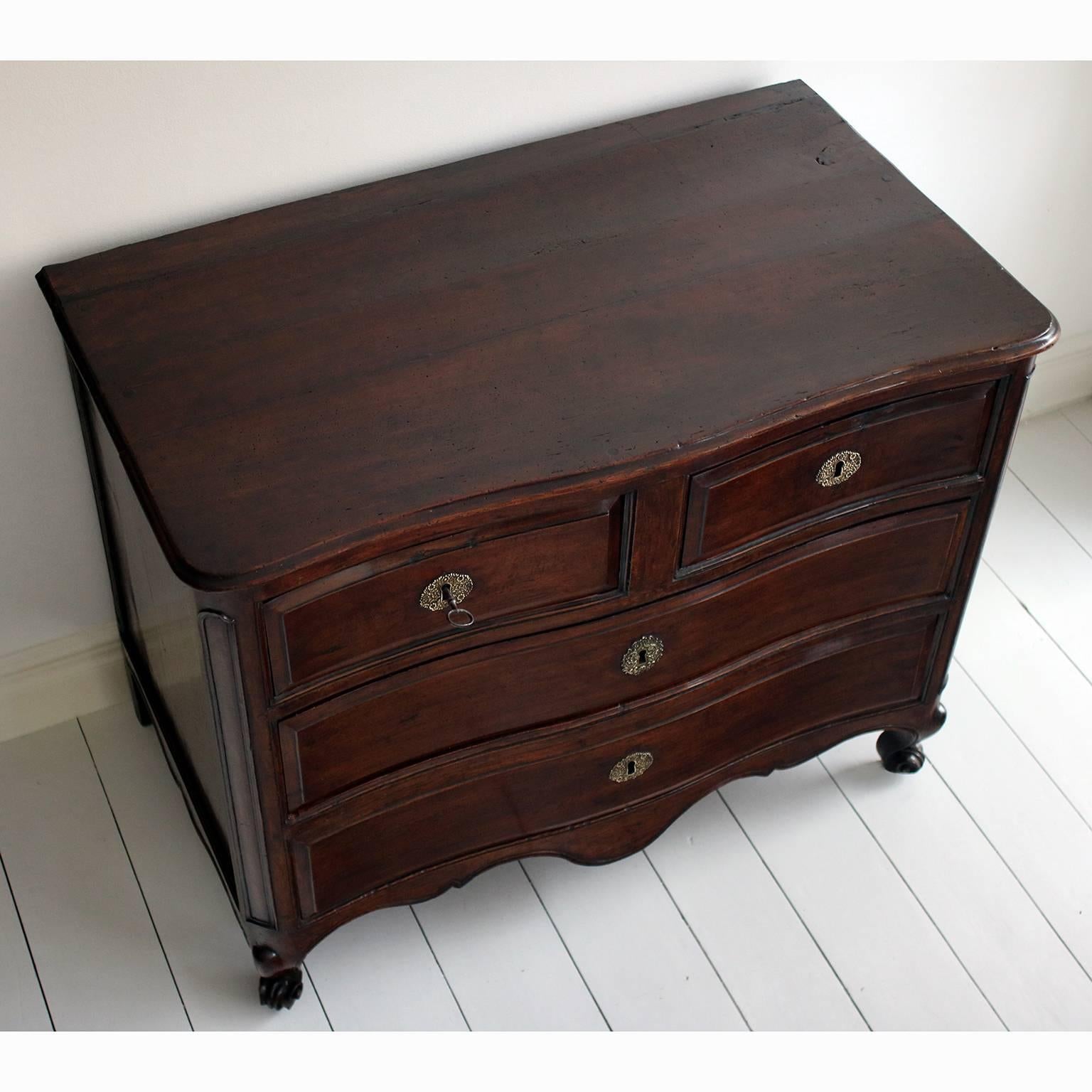 A French walnut commode with original escutcheons, locks and key. The commode is a beautiful rich colour and in excellent condition. 