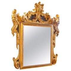 18th Italian Rococo Mirror in Carved and Gilded Wood with Rocaille Trim