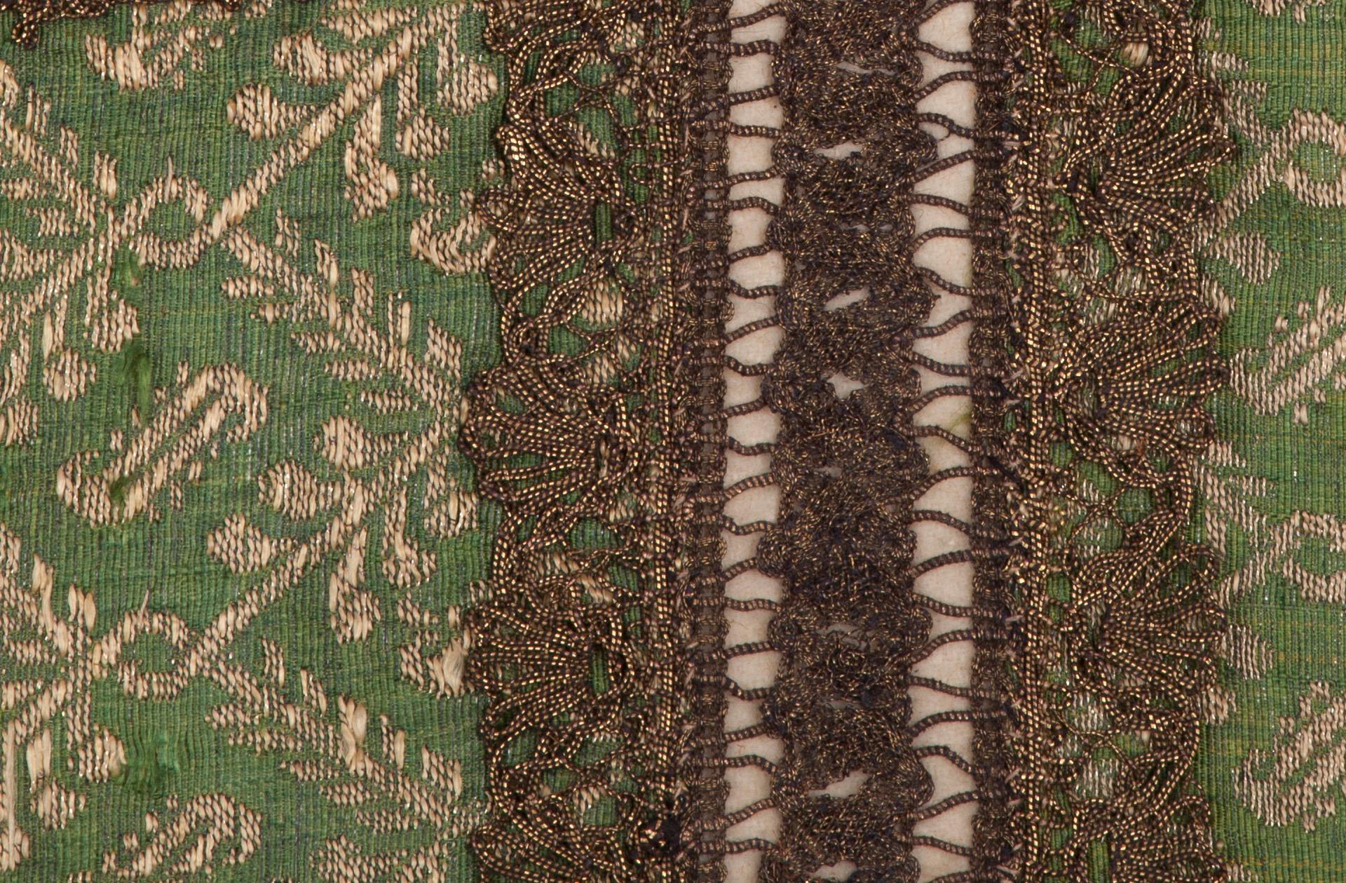 Possibly created for religious use, this 18th or early 19th century French (Lyonnais) item unites 4 panels of 18th century silk brocade with fancy metallic passementerie.