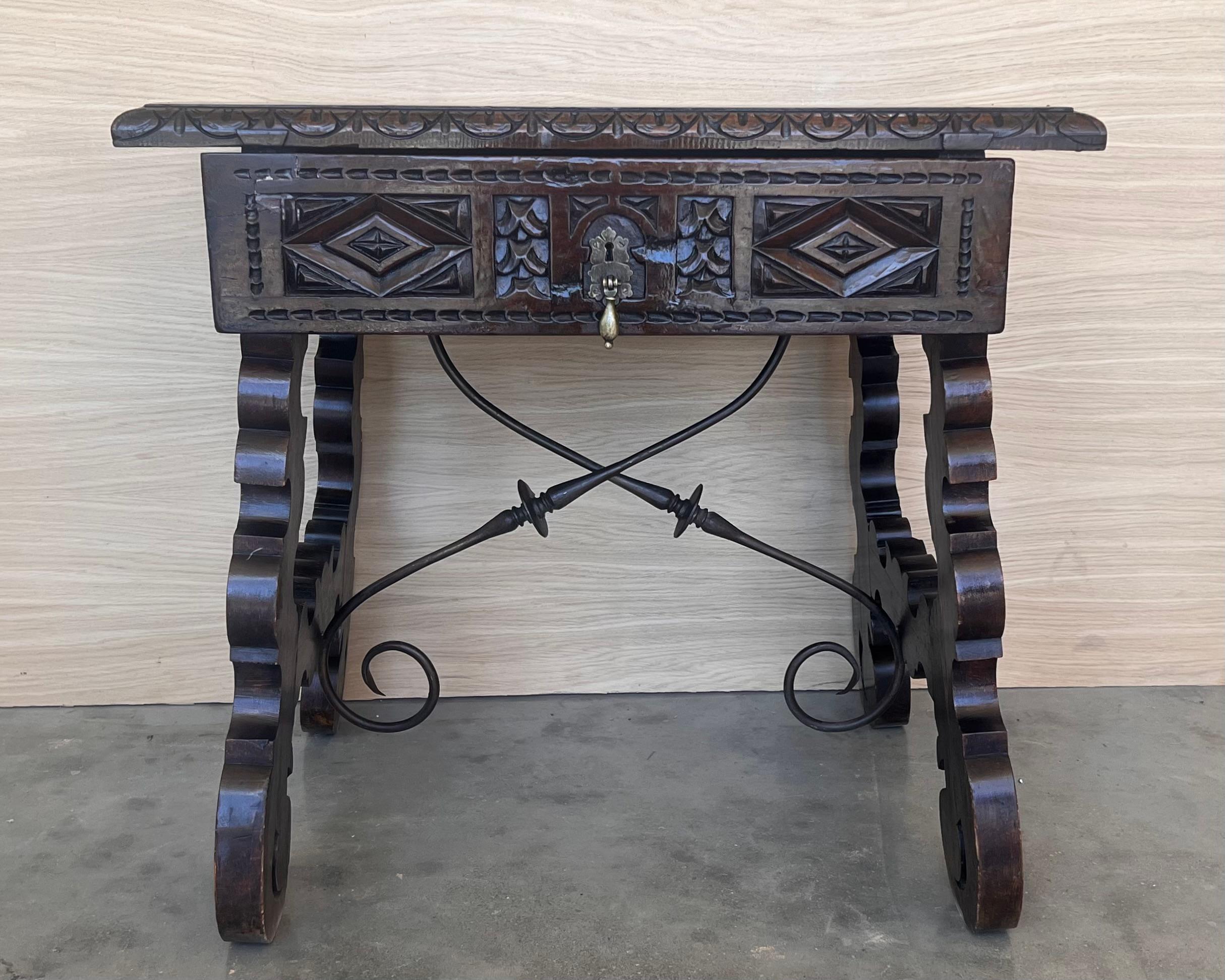 This  Spanish 19th century features a beautiful one plank rectangular top over a carved drawer featuring slightly different hardware, is adorned with geometrical motifs and their original handmade drop pull.
Black ebonized walnut in all the