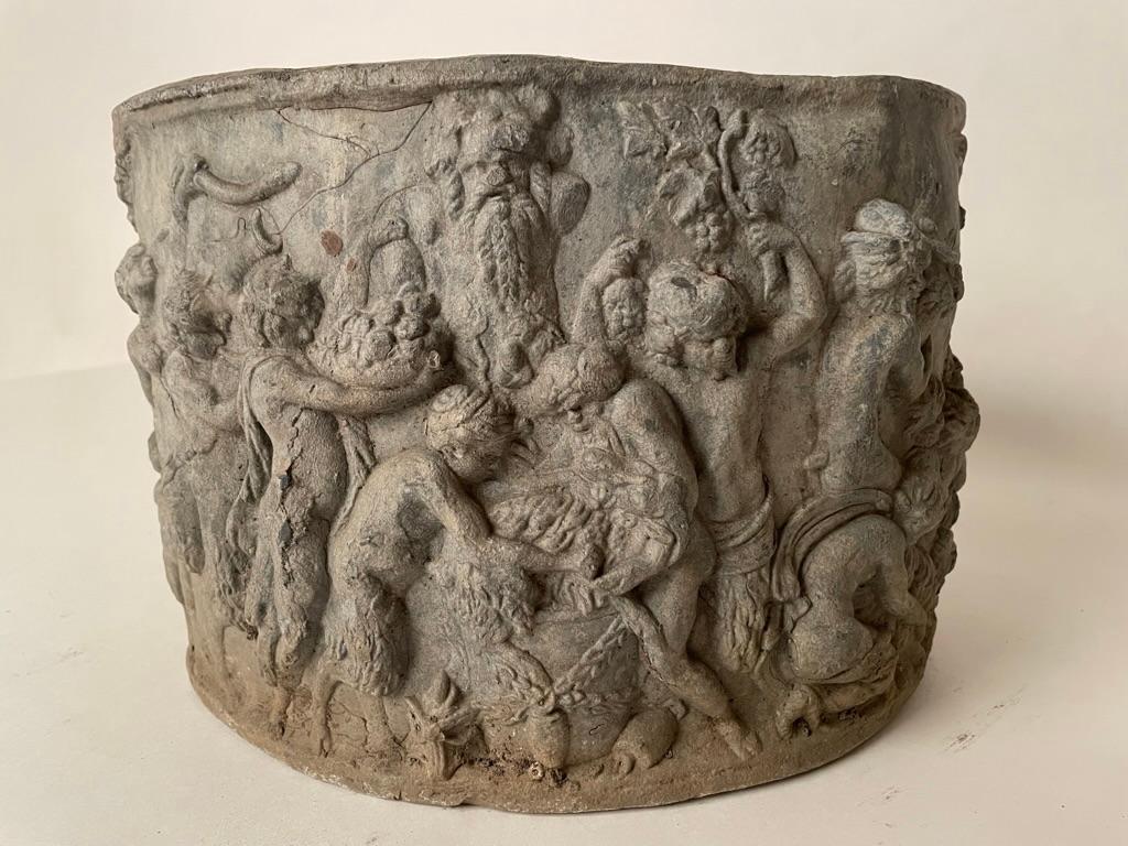 Very handsome English Neoclassical style lead planter with wonderful high relief scenes of a Bacchanalian celebration. Showing a group of satyrs bringing offerings of fruits, vegetables and a goat to a herm of Priapus, Greek and Roman fertility god,