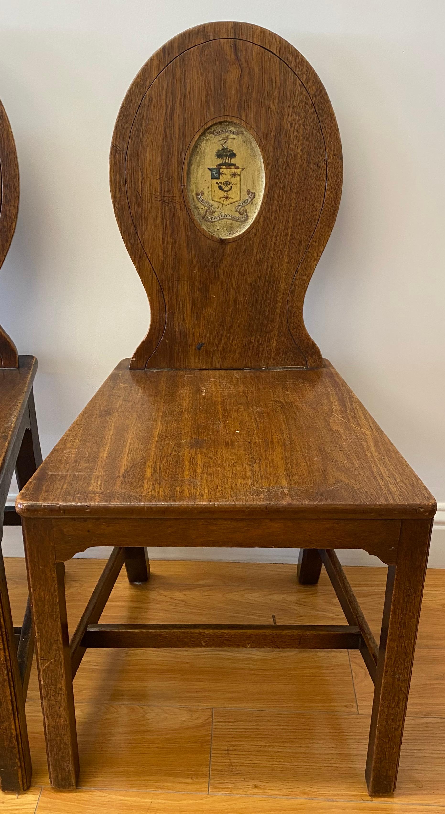 18th-19th century George III European walnut hall chairs

Handsome pair of handcrafted custom made hall chairs

Each chair has a plank seat and back fitted with a wedge joint

Measures: 18.25