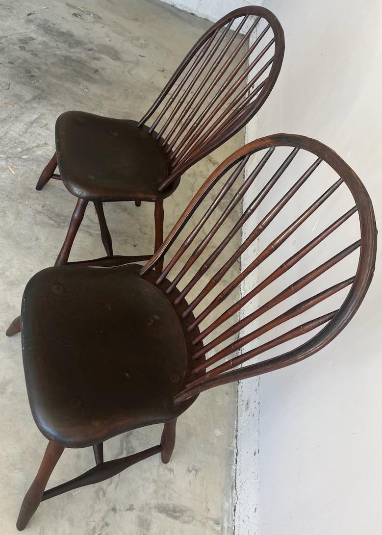 18th century original red painted bow back Windsor chairs from New England in fine condition. These chairs have a nice deep red painted surface and wonderful patina. Found in Pennsylvania and very durable & sturdy.