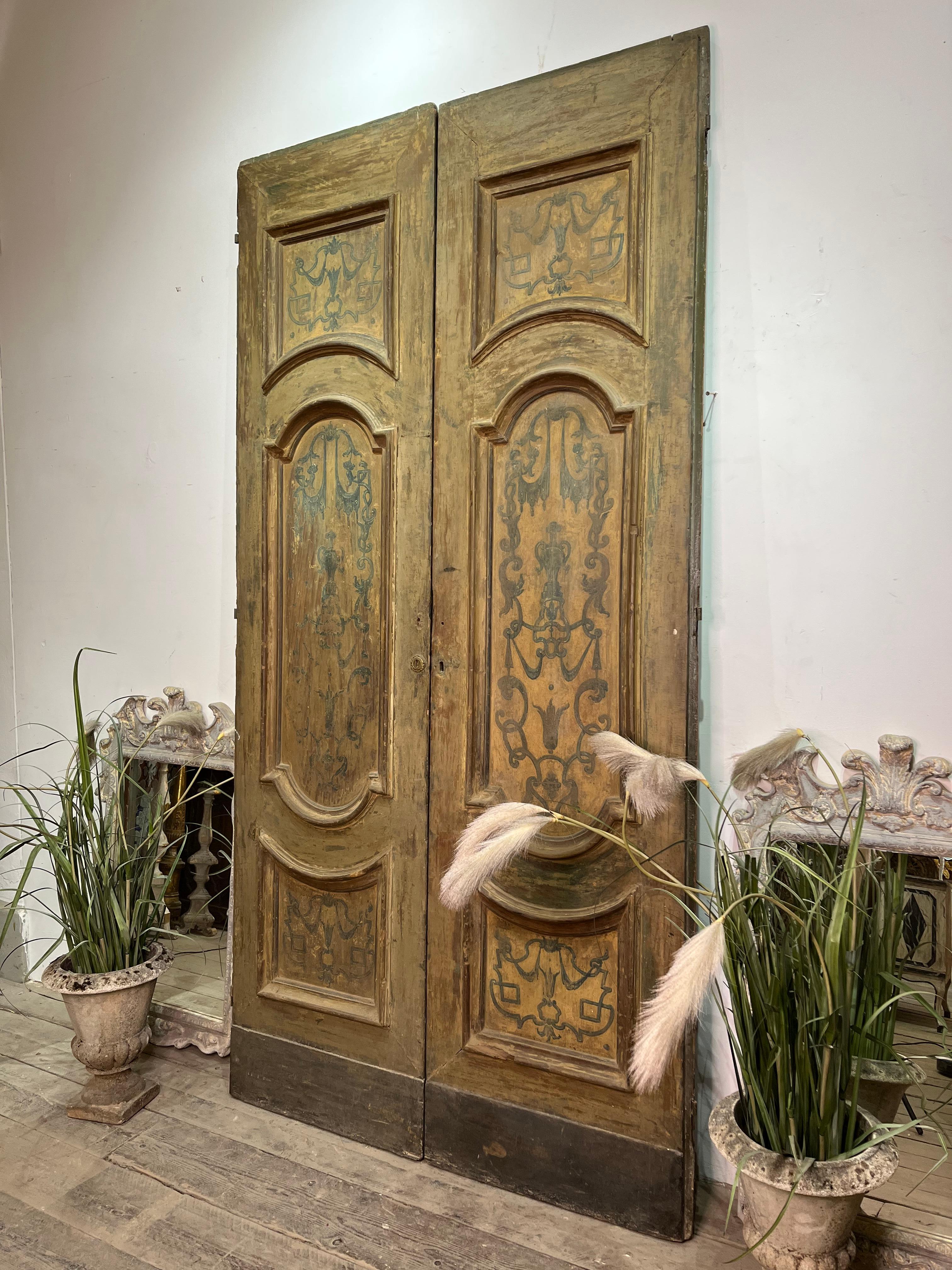 Majestic and large size first 18thC doorway from Napoli, Italy.
Beautiful first patina with decorations inside each frame.
Original hardware. Backside is simpler.
It can be set in its exact role as doorway or be used as a decorative element.