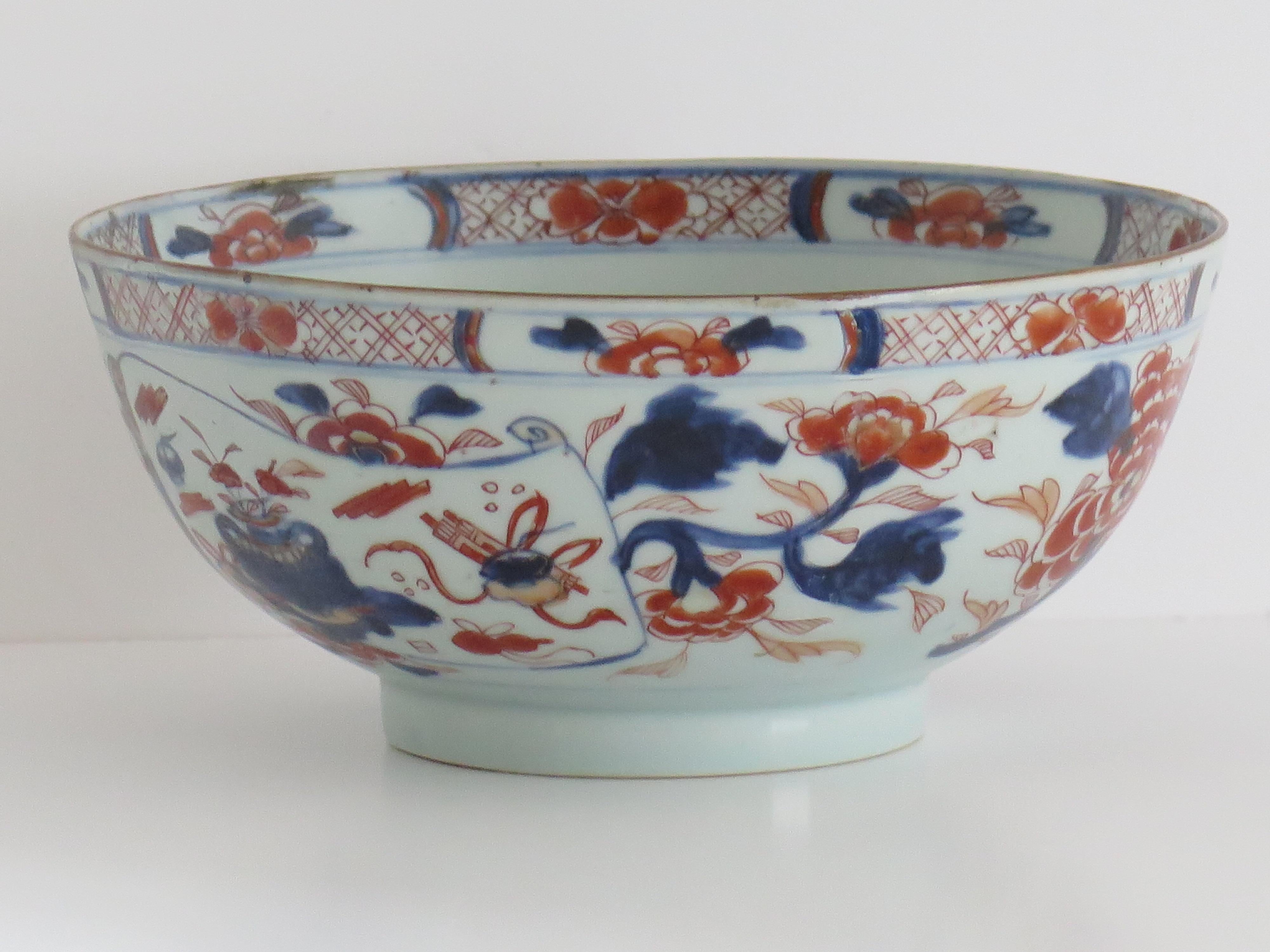 This is a beautiful Chinese Export porcelain footed Bowl with fine Imari hand painted decoration, which we date to the turn of the first half of the 18th century, circa 1730. 

This bowl is well potted on a fairly high foot and of a good 9 inch