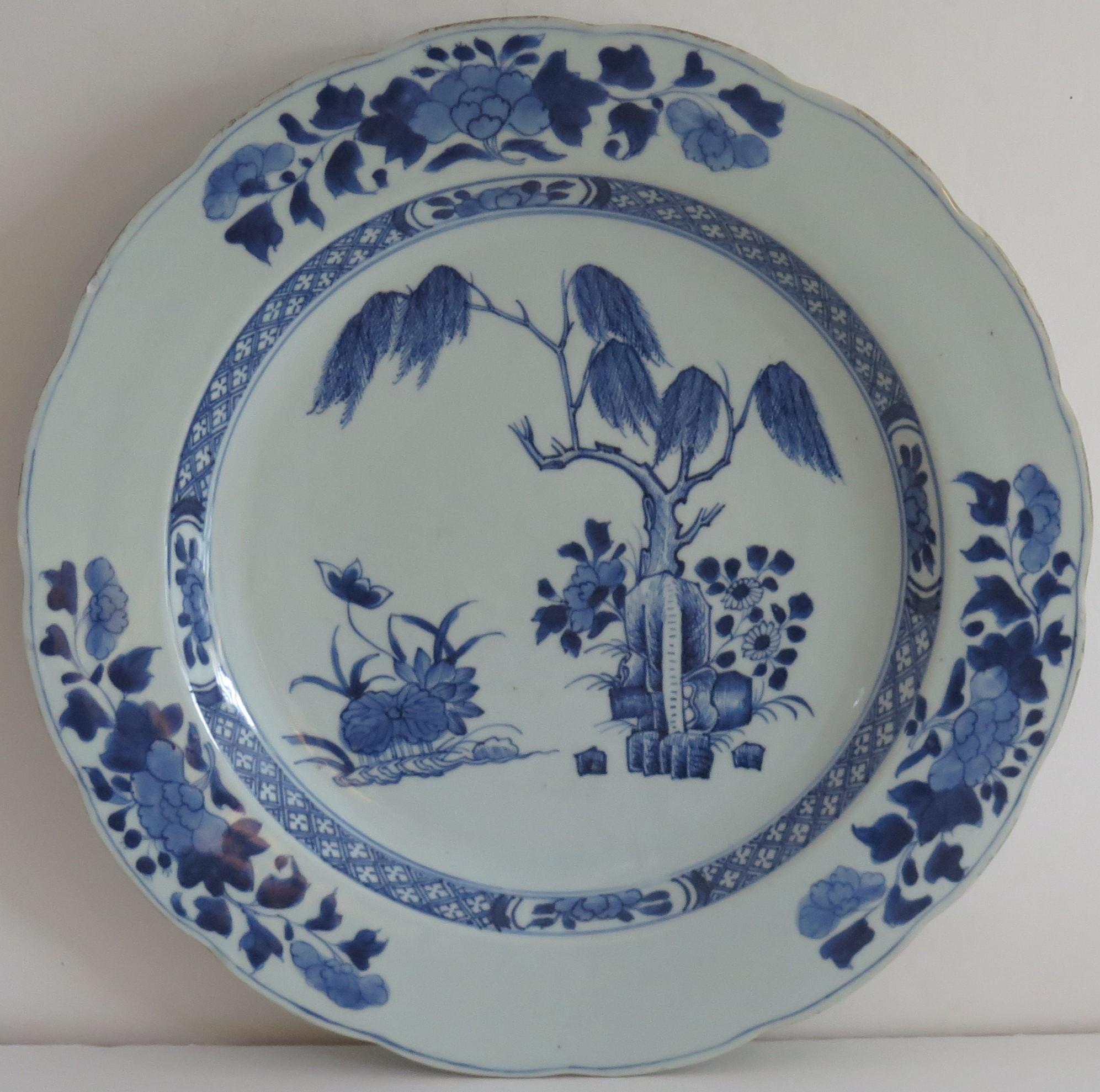 This is a beautiful hand painted blue and white Chinese porcelain Charger, dating to the second half of the 18th century, circa 1770, Qing dynasty, Qianlong.

The charger is well potted with a wavy rim and has been hand decorated in varying shades