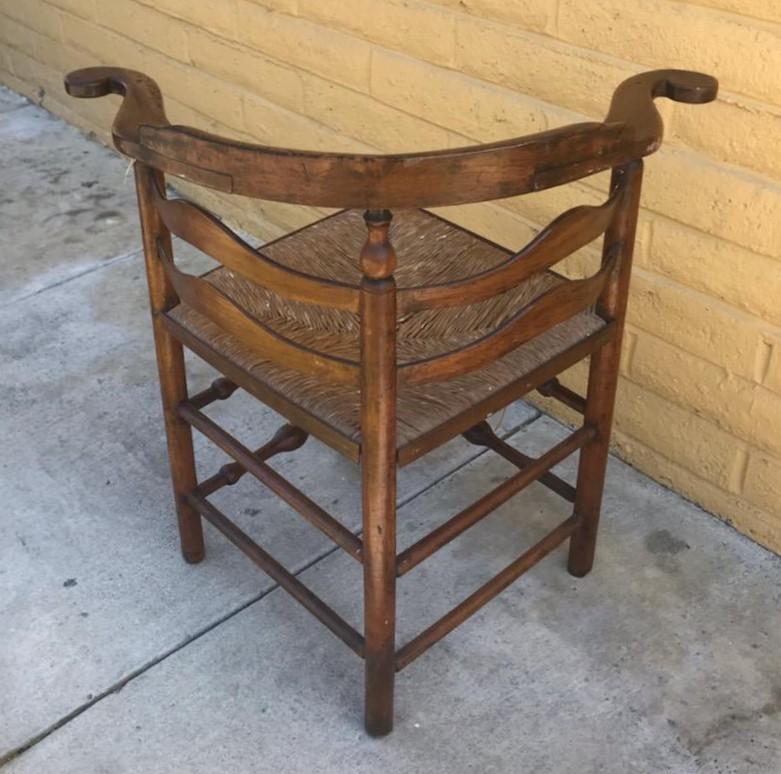 18th century New England corner chair from with original woven seat. The condition is very good and sturdy with a nice mello patina.