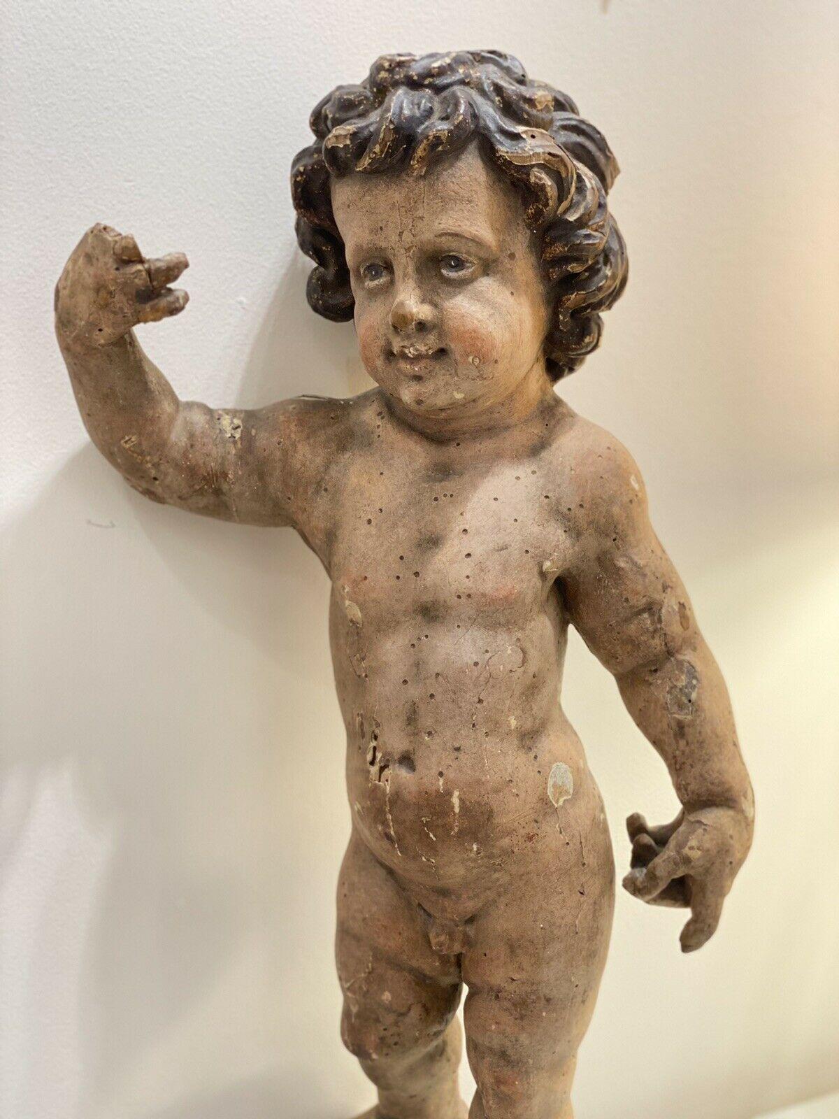 On offer an 18thc Large Beautiful French Wood Sculpture of a Putto/ Angel Figure. There are losses, on fingers, feet etc. Please look closely at pictures. This is a piece of antiquity. Non active wood worm holes. I purchased this sculpture from a