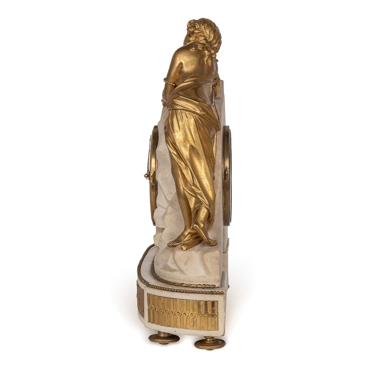 An exquisite 18th Century Louis XVI mantel clock crafted in ormolu and marble, adorned with intricate detailing. Housed within a meticulously carved marble case, the clock features a charming lady figure and cherub embellishments on each side,