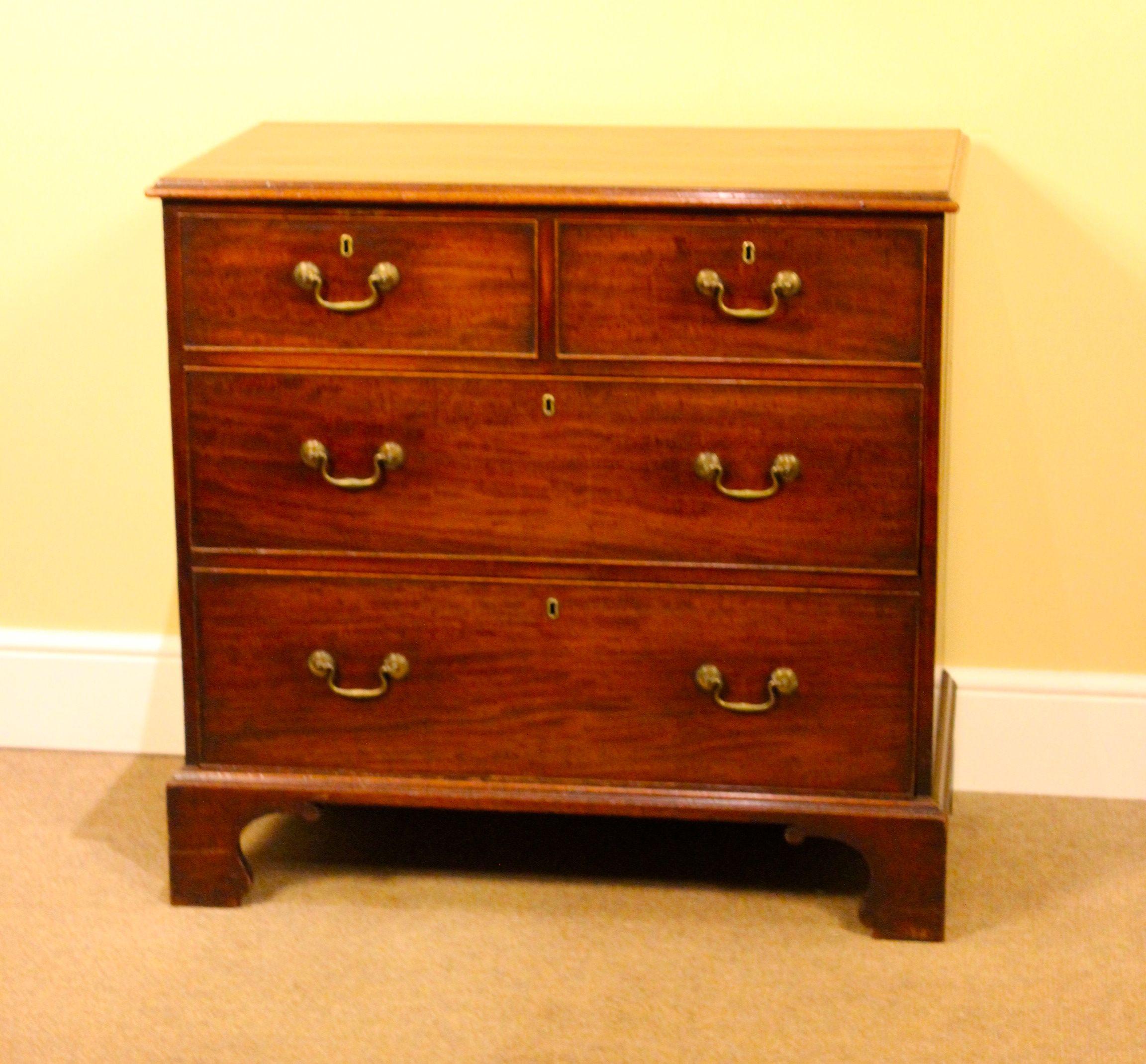 5801
18thc. Mahogany Chest of Drawers
With two short & two long drawers.
Very original with brass swan neck 
Handles on bracket feet.
37.5”w x 36”h x 20.5”d
95cm w x 91cm h x 52cm d

Items can be delivered by independent carrier but please note NOT
