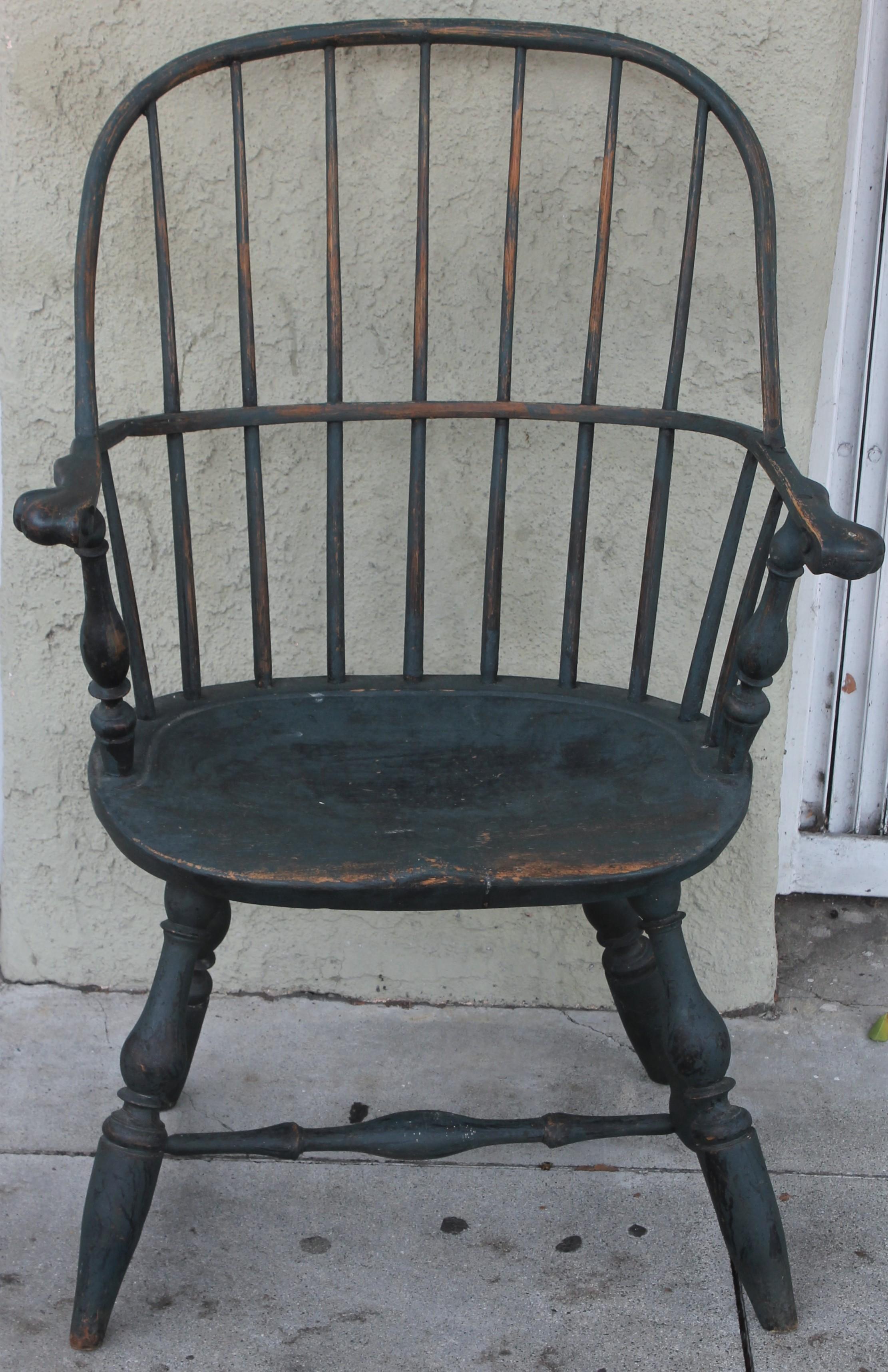 This fantastic 18thc Lancaster lounty, Pennsylvania Windsor is in original blue painted surface. This extended knuckle arm chair has wonderful worn patina. The saddle seat has wear and amazing surface.