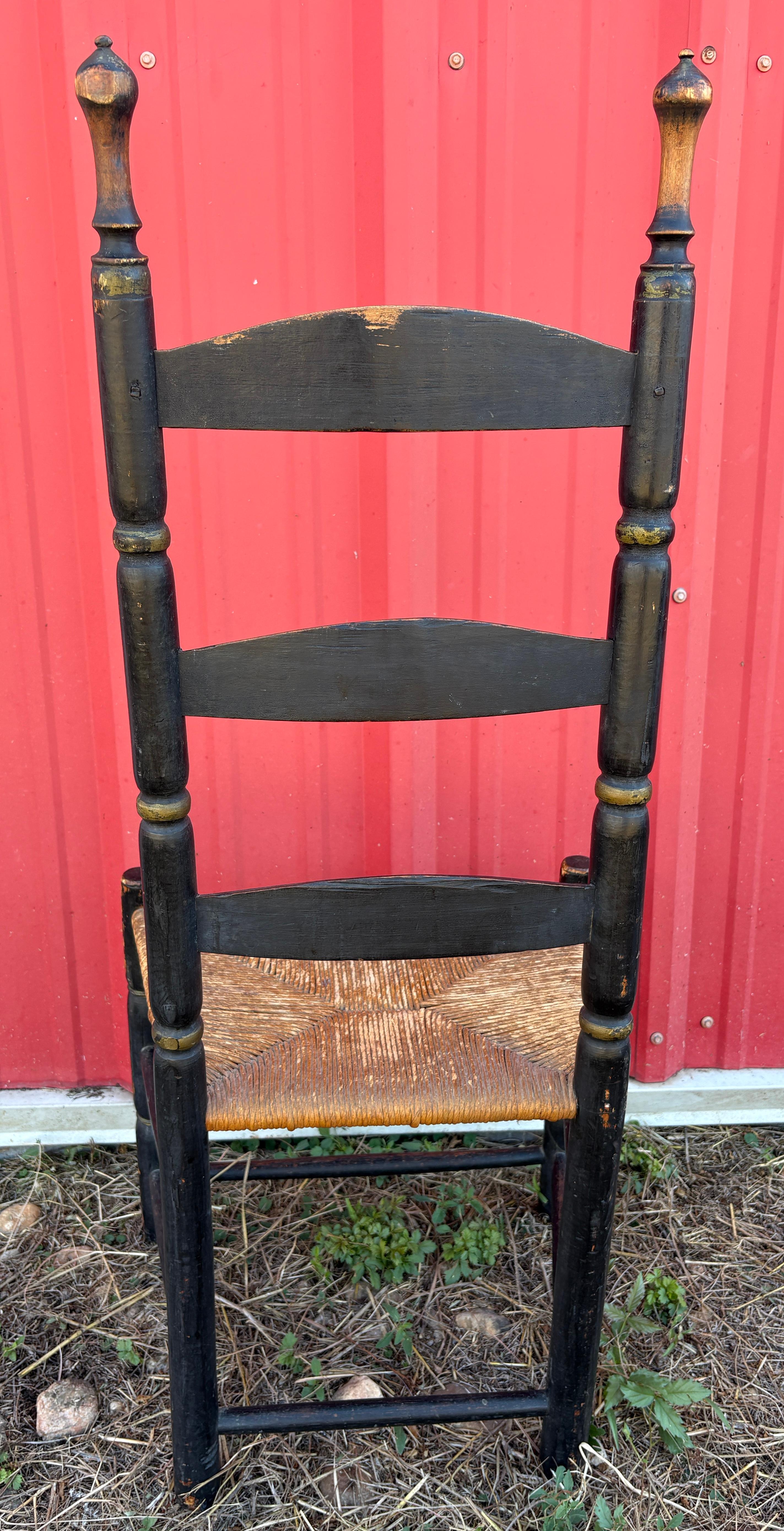 18Thc Original black painted ladder back chair with original  hand made rush seats.The condition is very good.