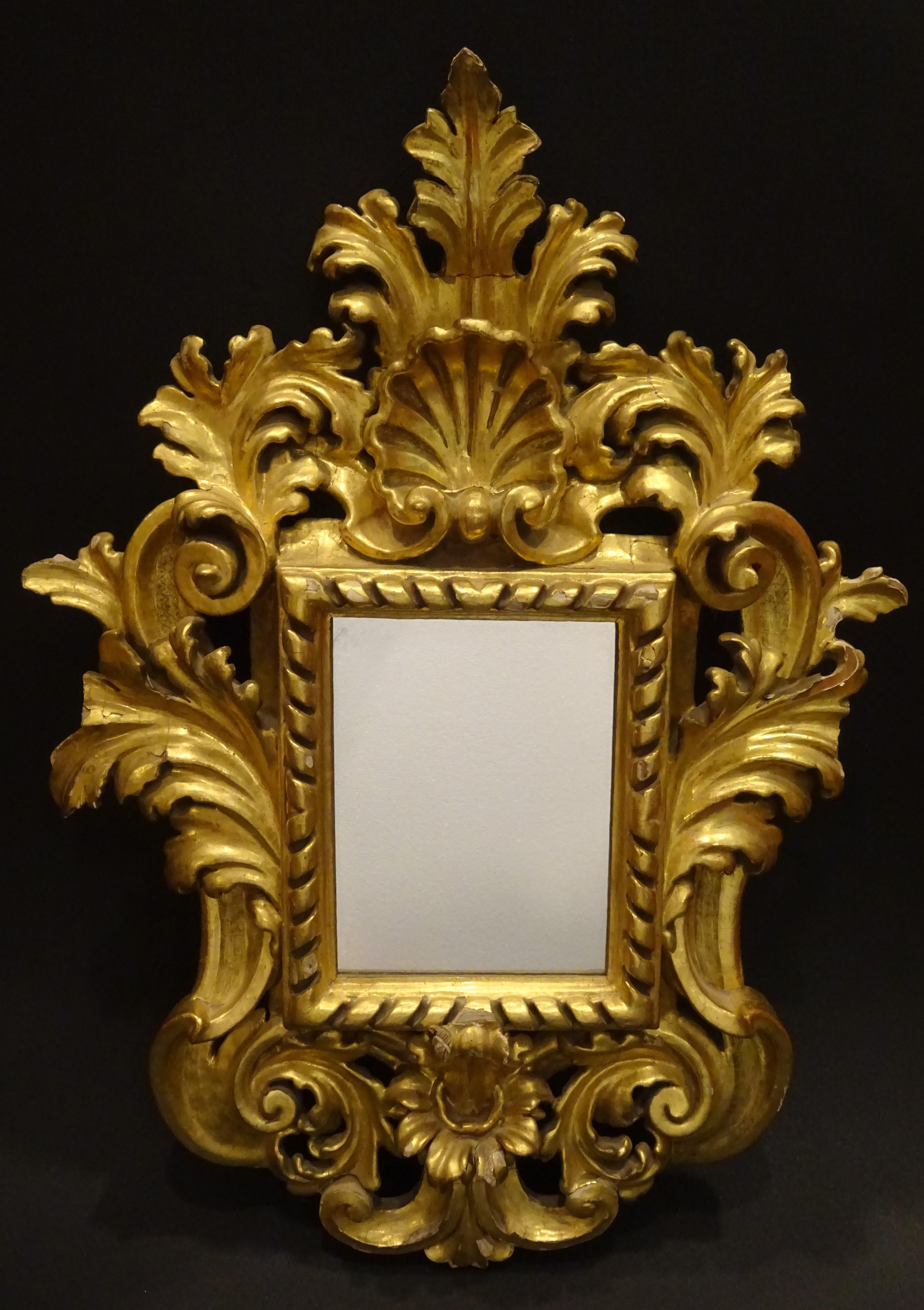 Amazing one of a kind couple of French Baroque carved and gilded wood wall mirrors, with a 24-karat gold with a high quality and in a very good condition with age and use.
With carved and gilded wood acanthus leaves and rockery
Very sought after