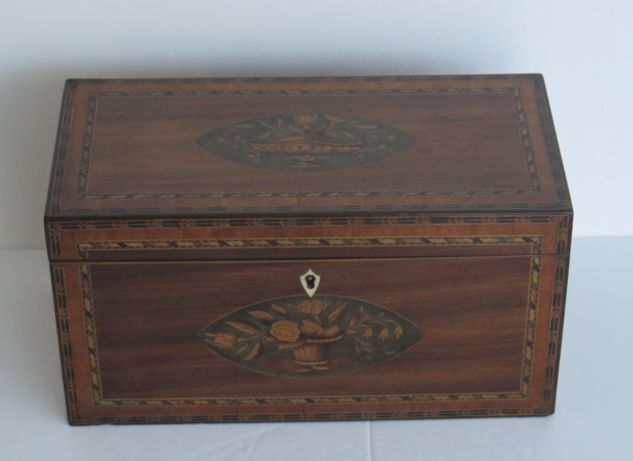 A very beautiful, fine quality, inlaid tea caddy from the English Georgian, Sheraton Period, Circa 1785.

The tea caddy is all handmade with very fine quality features;
* Beautifully chosen figured mahogany.
* Exceptional inlays of Shells and patera