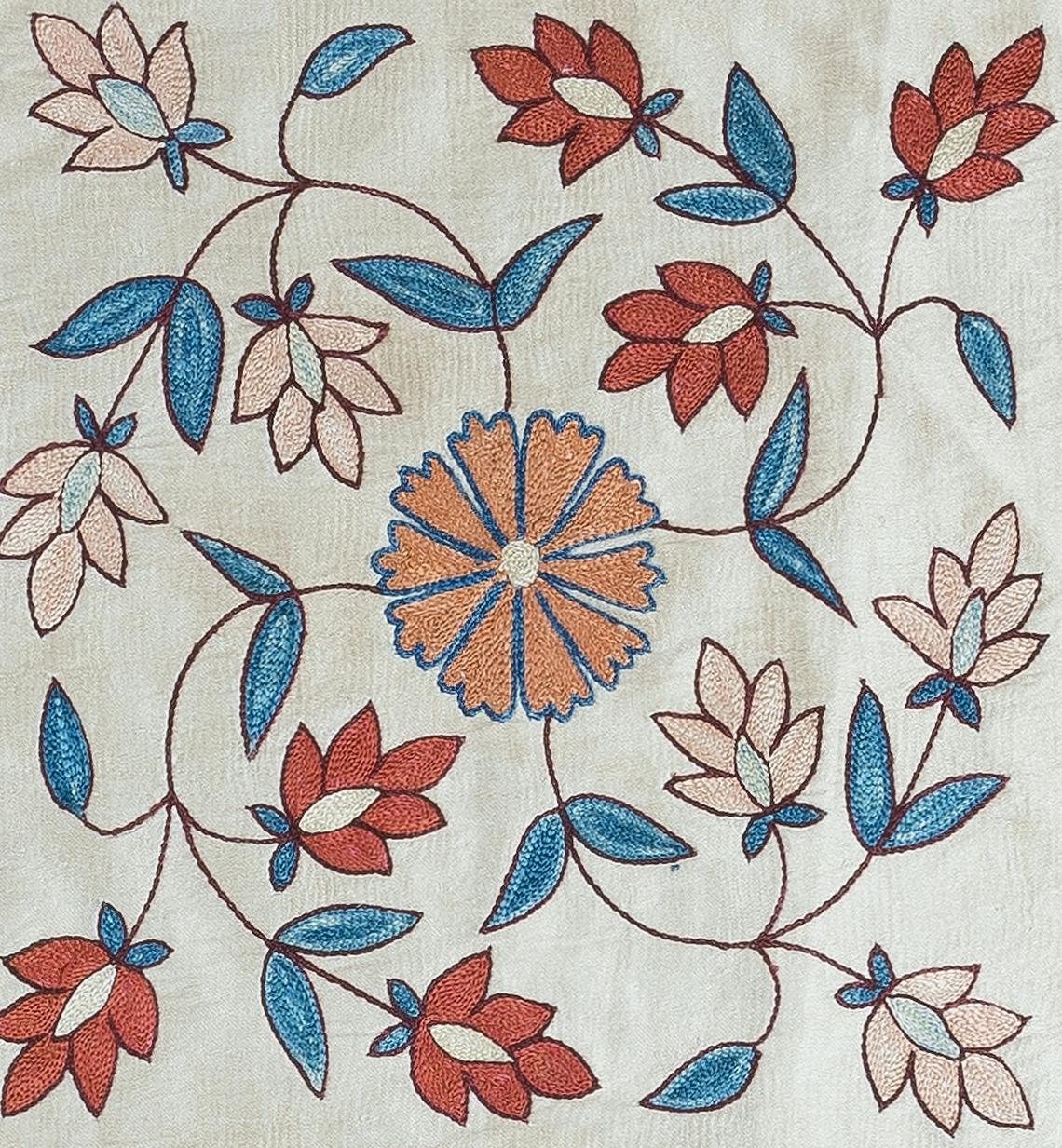 Decorative suzani cushion cover made of hand embroidery silk on silk background, flowers and vine motifs, linen backing with zipper, no insert.

Delicate and specialised washing advised.

Suzani is a type of hand-embroidered and decorative
