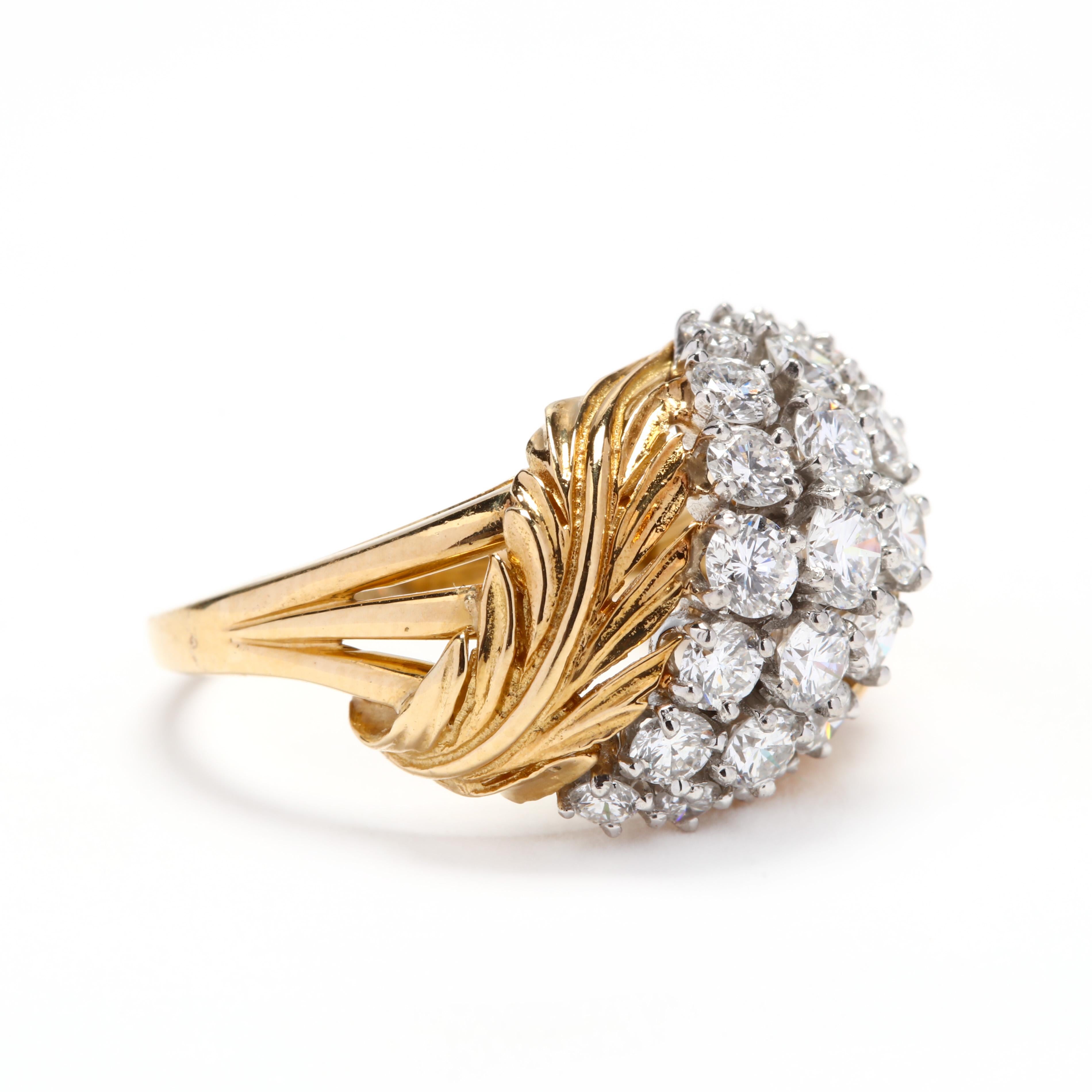 A vintage 18 karat yellow gold diamond cluster leaf ring. This ring features a cluster of prong set round brilliant cut diamonds weighing approximately 1.70 total carats with a leaf motif on either side and a triple split band.

Stones:

- diamonds,
