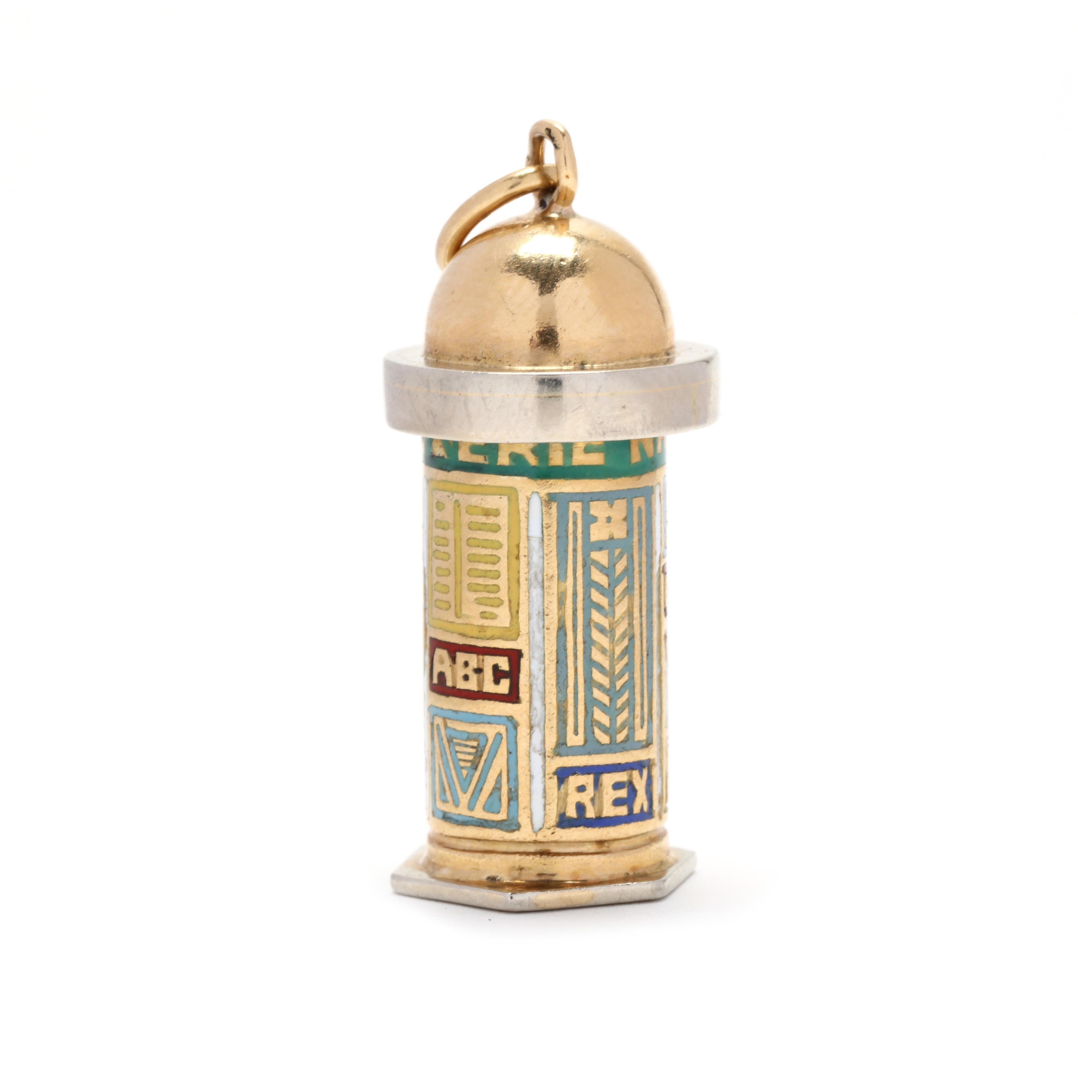 A vintage 18 karat yellow gold French Paris new kiosk charm. This charm features a cylindrical design with a domed top and a hexagonal bottom, and with multi-colored ename detailing. This charm also features French hallmarks on the bail.

Length: