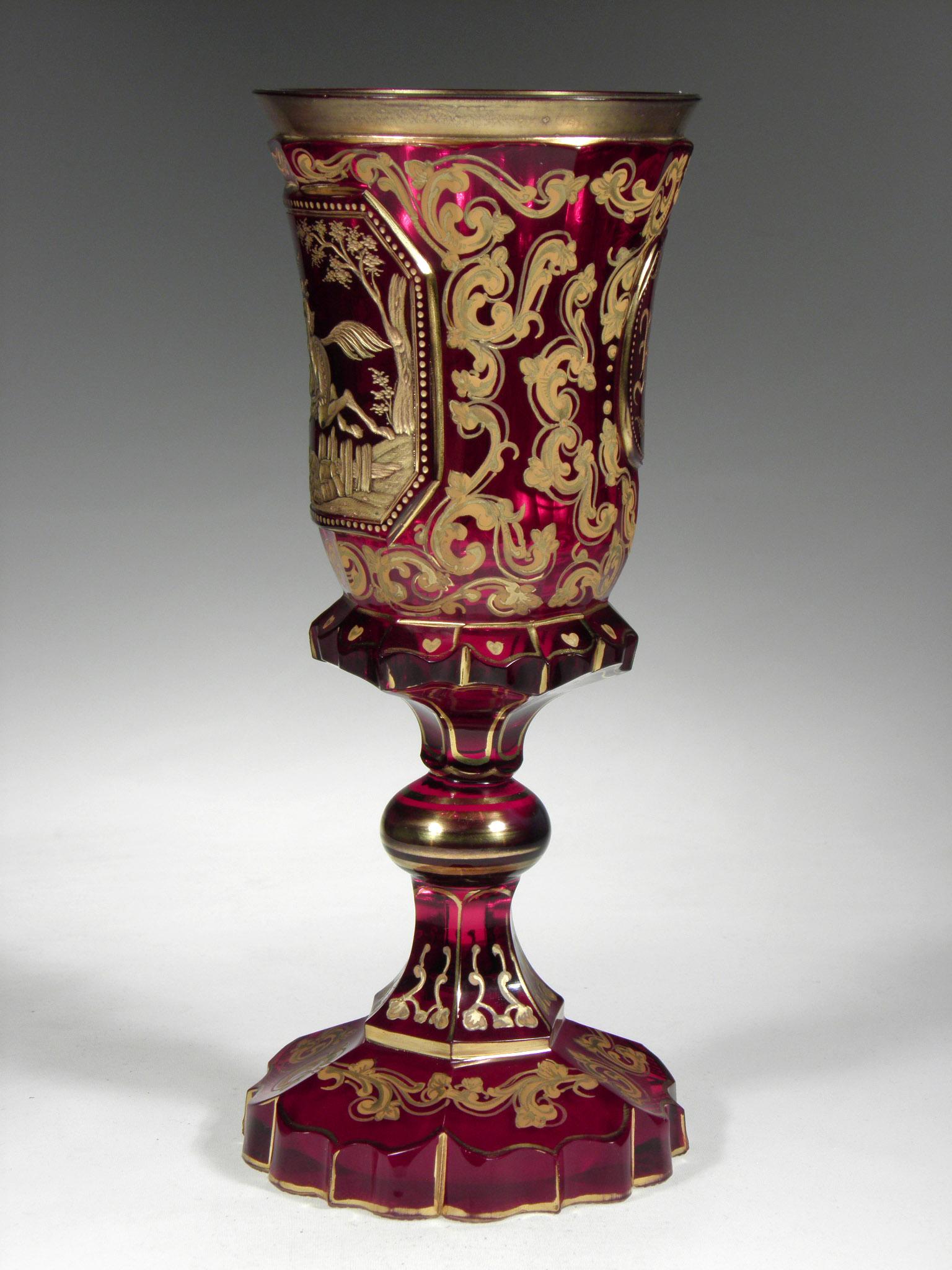 Antique Bohemian Ruby Glass from 19th-20th century with Mameluck and horse motive.
Hand painted with gold. Golded engraving and initialts.