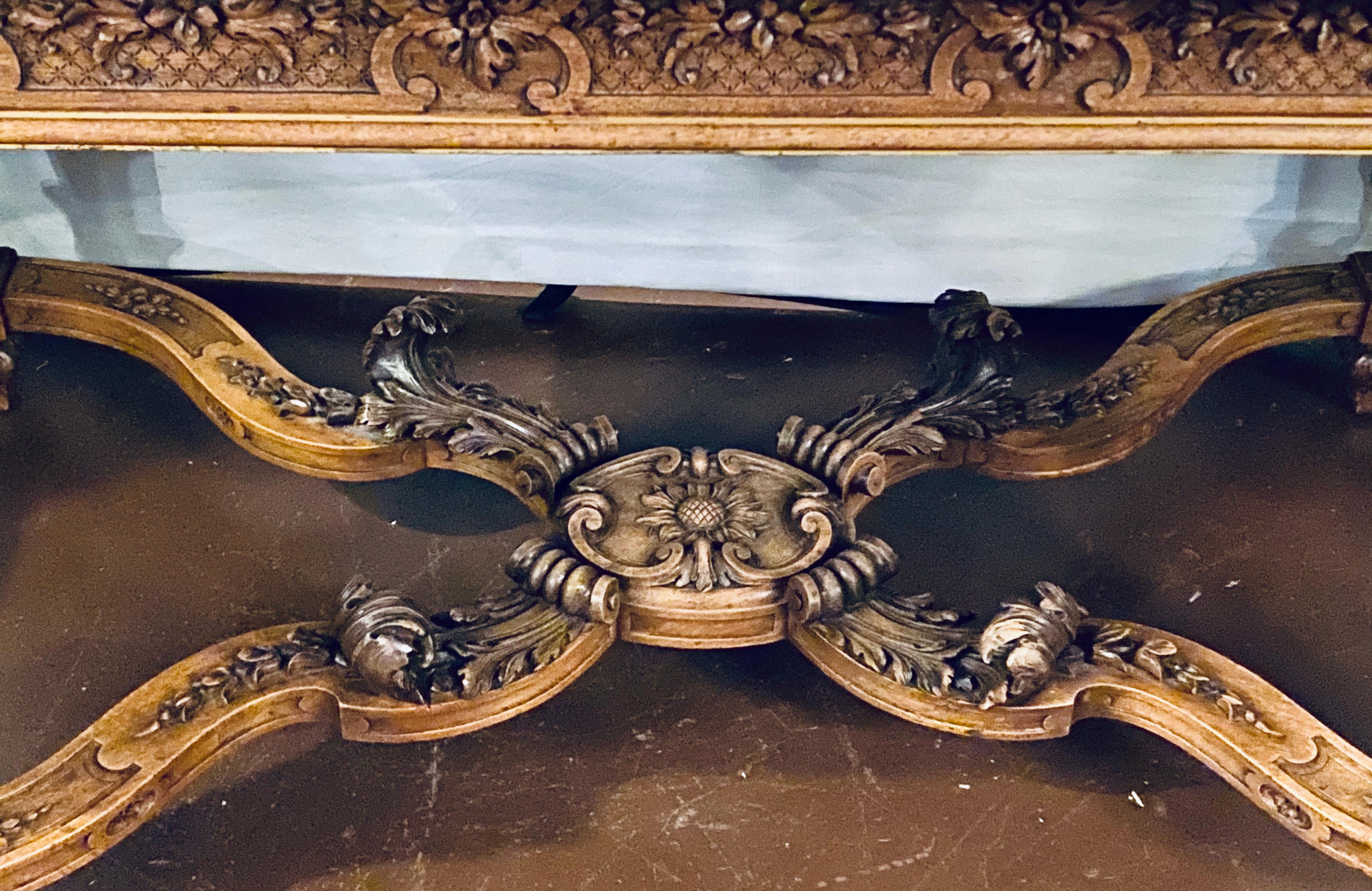 19th-20th century Louis XVI style Rouge marble top center table having a spectacular undercarriage supporting the four finely carved legs, this large and impressive center, almost dining table sized piece is certain to have visitors gasp as they