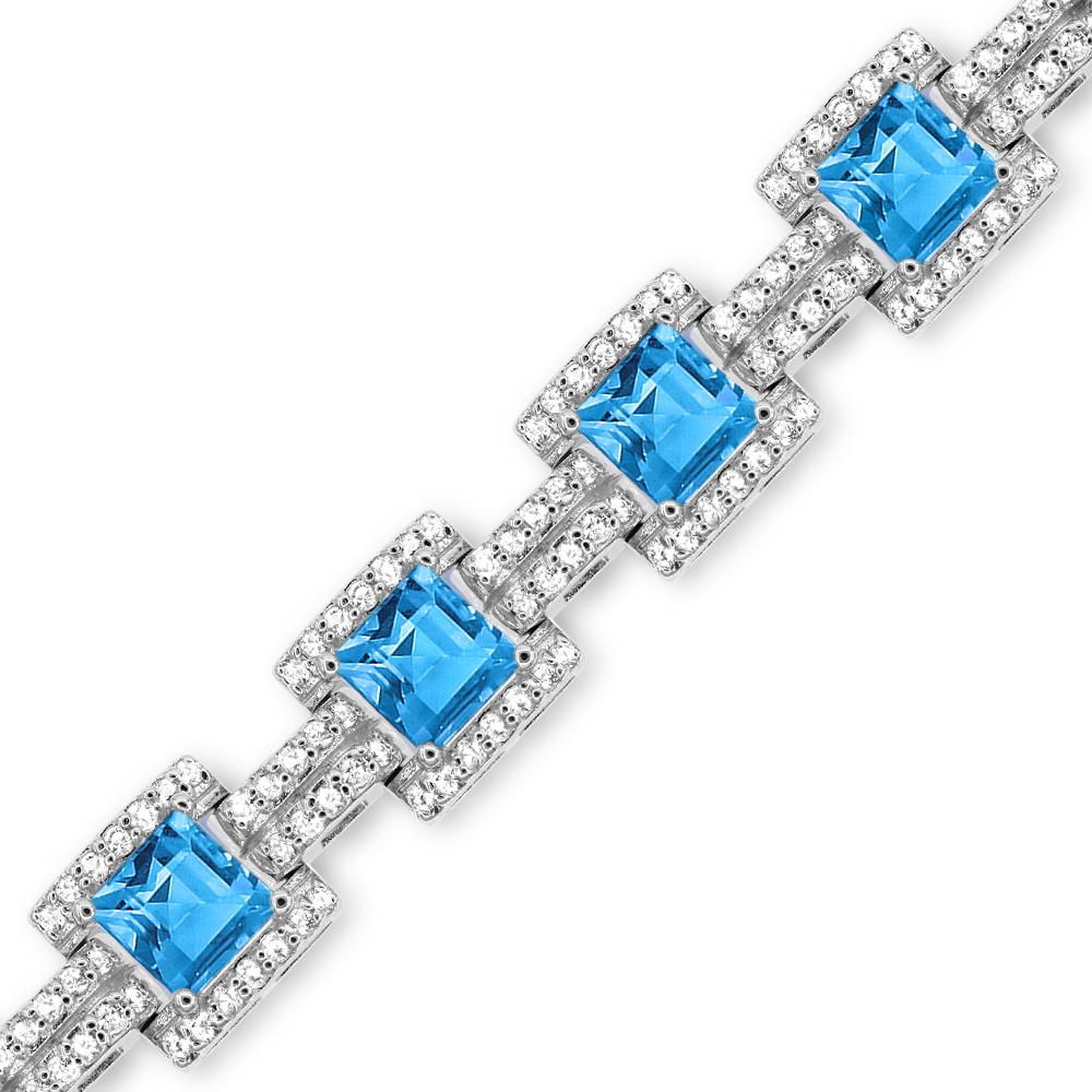 This elegant sterling silver tennis bracelet features 12 square cut Swiss blue topaz measuring 6mm accented by 288 shiny round white topaz gemstones secured with lobster claw closure. 

Metal: Sterling Silver
Gemstones: 
Square Cut Swiss Blue Topaz: