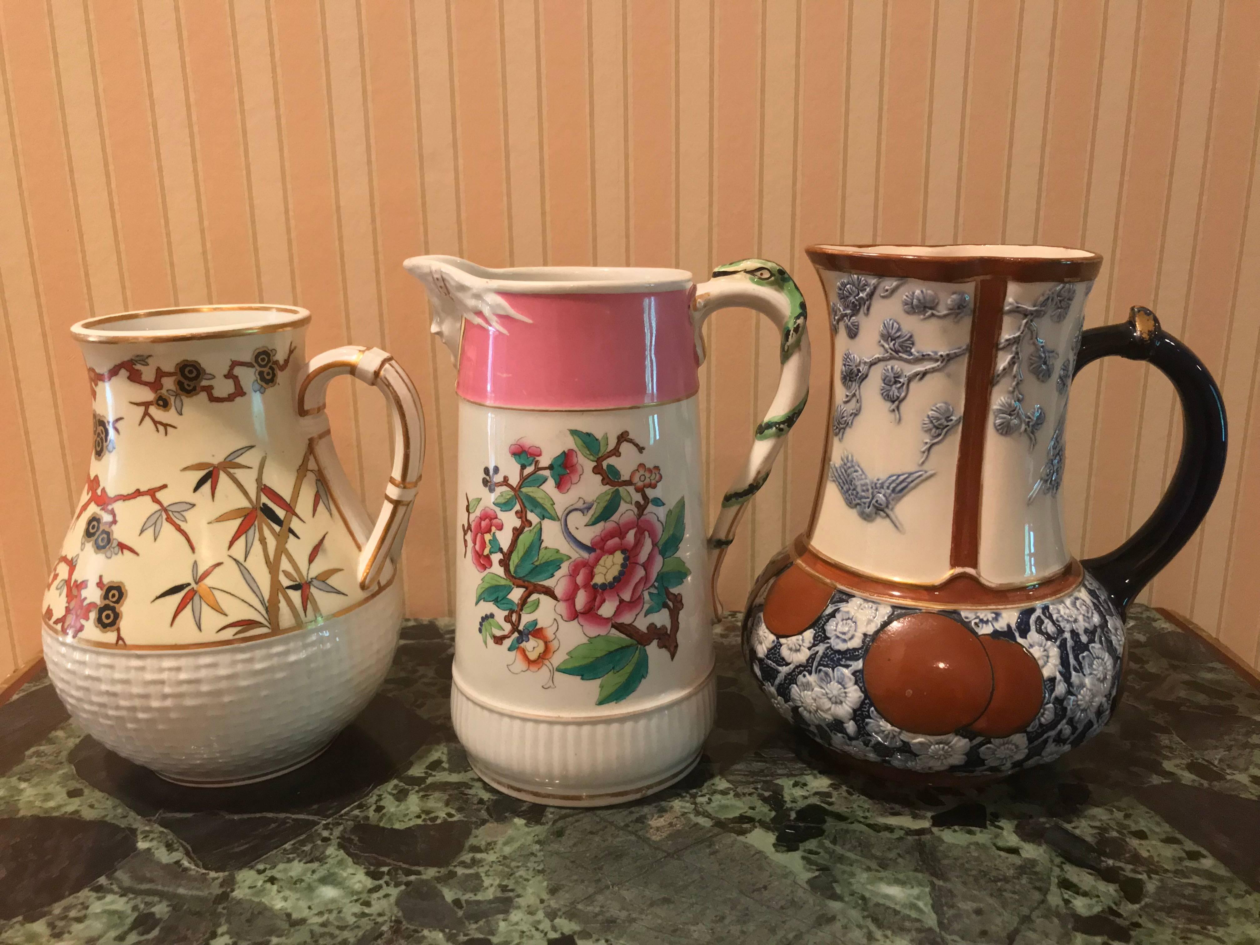 19 c. Lot of three (3) Japanese style English  porcelain jugs/Pitchers. 1) Antique Minton aesthetic jug. Japanese dogwood by Christoper dresser, 7
