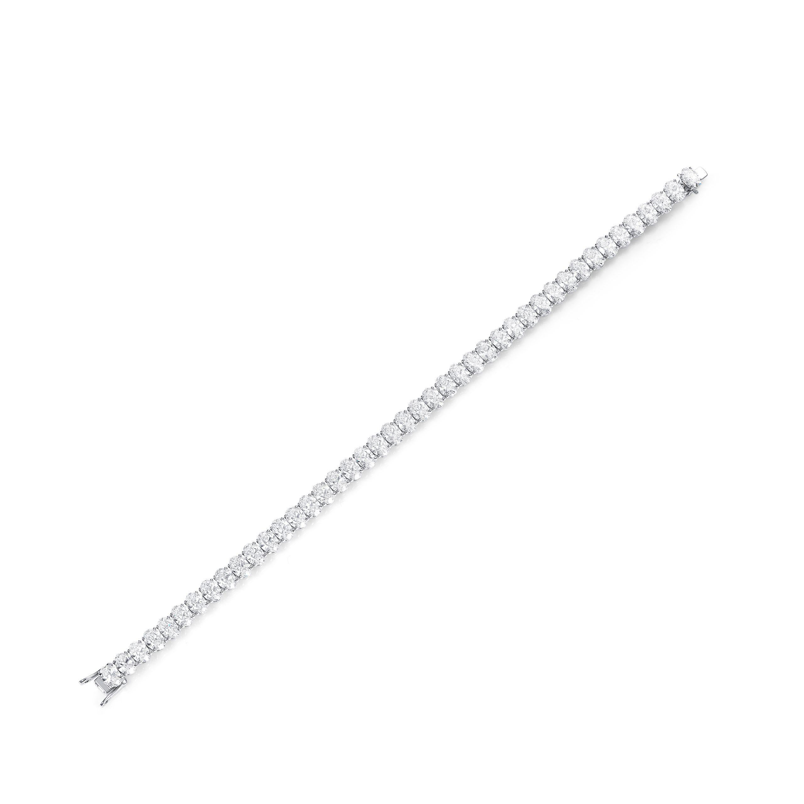  Platinum Tennis Bracelet with GIA Certified Diamonds

Indulge in the epitome of luxury with our breathtaking platinum tennis bracelet adorned with 38 GIA certified oval cut diamonds. Each diamond, meticulously selected for its exceptional quality,