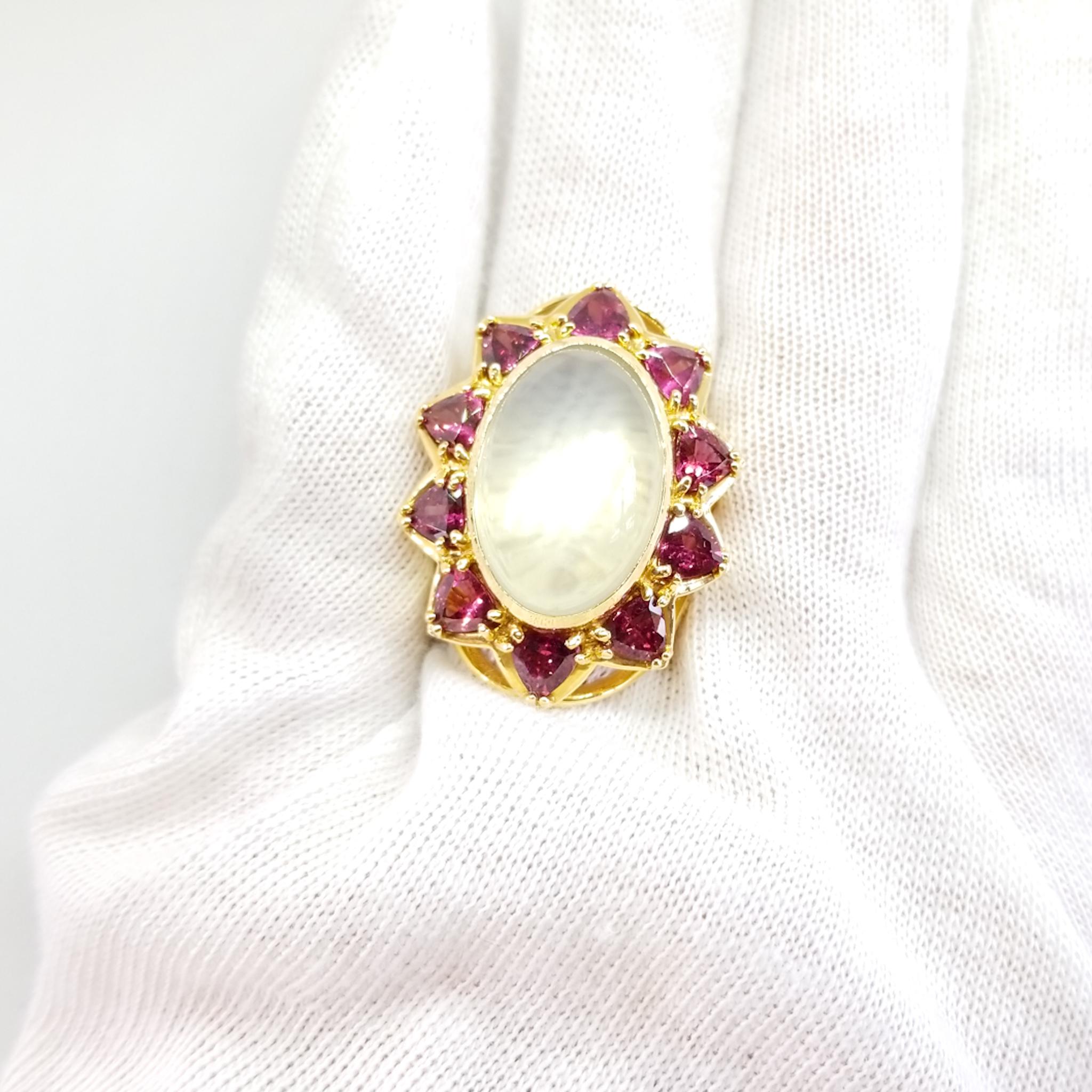 This Beautifully made, Contemporary Statement Ring features a 19.04 Carat Moonstone Cabochon. The Oval Shaped, High Cabochon stone is a Semi Translucent White with the Glowing characteristics of a Moonstone. The Stone is exceptionally clean with few