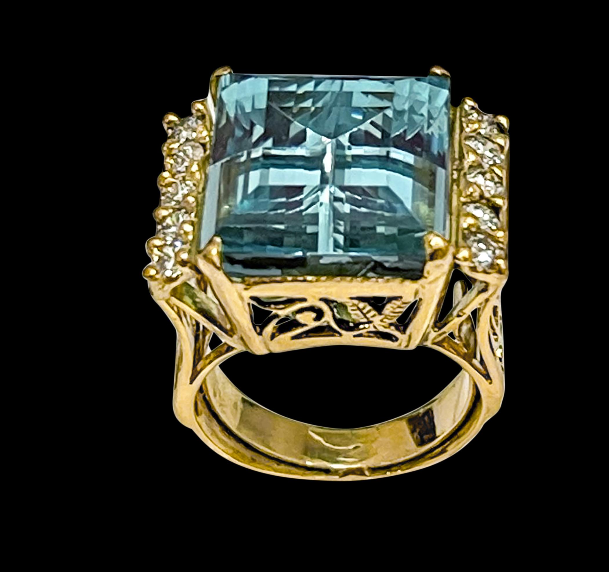 19 Carat Natural Aquamarine and Diamond Cocktail Earring, 14 Karat Yellow Gold Estate , Size 6
Natural Aqua Emerald cut stone  Measurements 16X14MM
Very desirable color and quality.
Gold 11.6 Grams
Brilliant cut Round diamonds , one row on each side