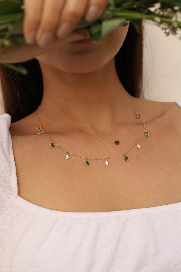 Emerald Necklace in 18K Gold studded with pear cut emerald pieces and diamonds.
Accessorize your look with this elegant emerald drop necklace. This stunning piece of jewelry instantly elevates a casual look or dressy outfit. Comfortable and easy to