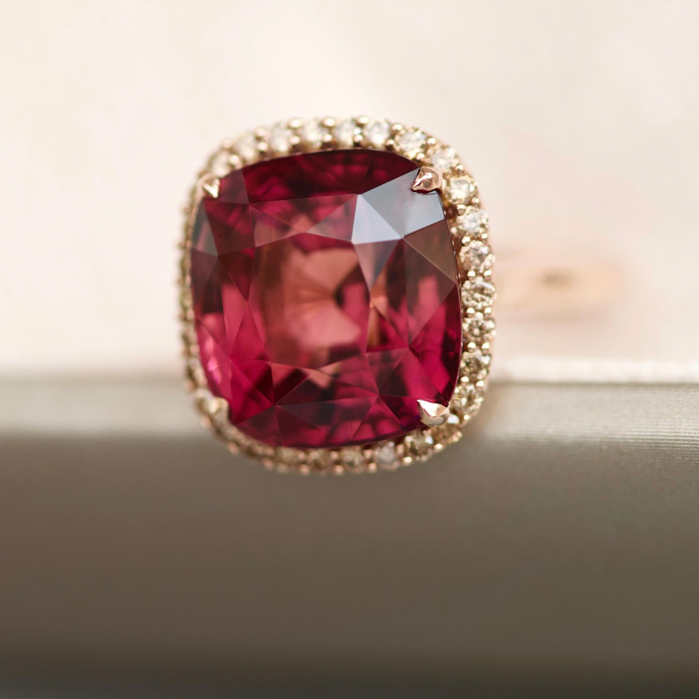 With beautiful and unusual stones you will always get beautiful and unusual jewelry. 
This is a real jewelry law. The center of this ring is a big tourmaline with a very complex shade - it is mix of bordo, pink, fuchsia and little bit peach