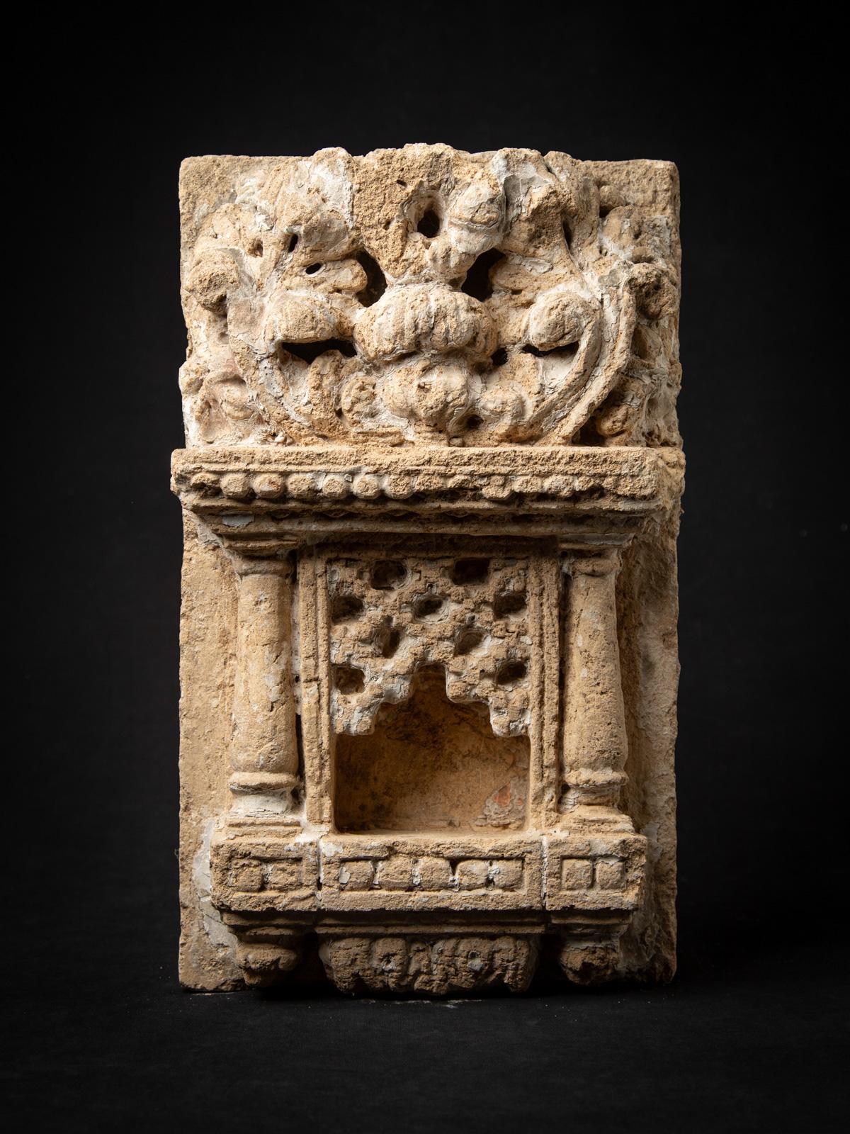 Discover this antique sandstone Indian temple, an exceptional 19th-century artifact showcasing exquisite traditional Indian artistry. Crafted from solid sandstone, it measures 47 cm high, 28.2 cm wide, and 14.5 cm deep, with an impressive weight of